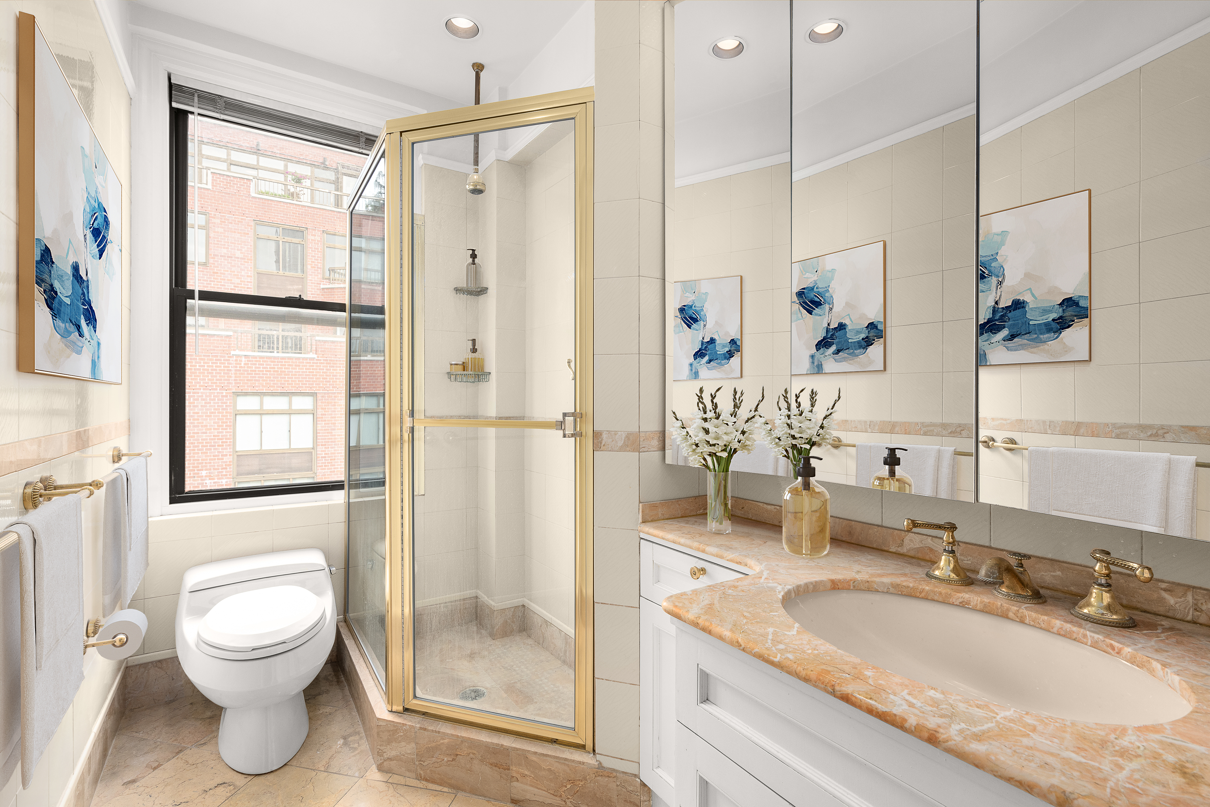 140 East 81st Street, Unit 12B Manhattan, NY 10028 - Photo 8 of 9 a bathroom with a granite countertop sink toilet and shower