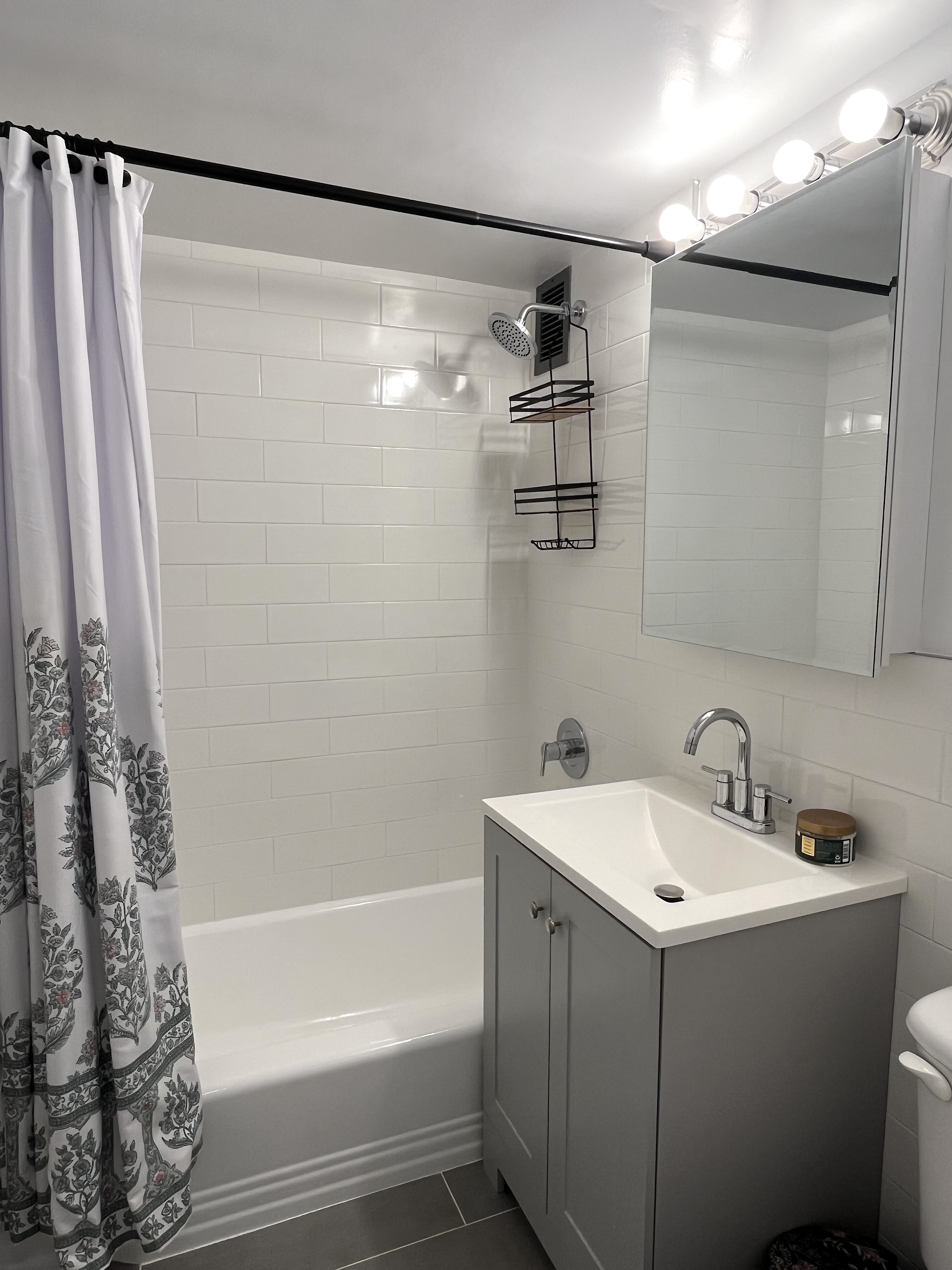 321 East 48th Street, Unit 10L Manhattan, NY 10017 - Photo 5 of 6 a bathroom with a sink and shower