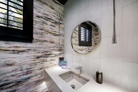 a bathroom with a sink and a window