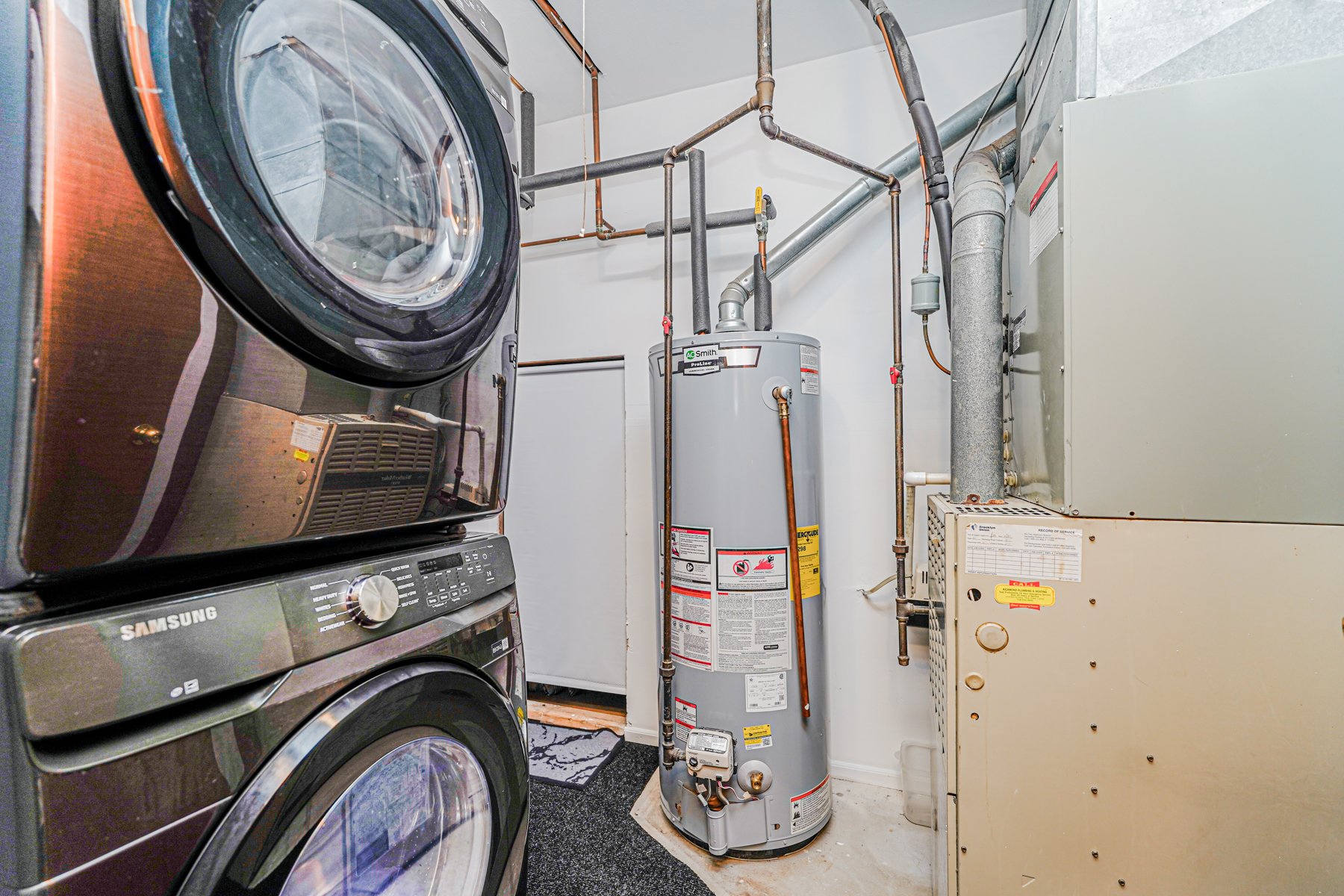 287 Greaves Avenue Staten Island, NY 10308 - Photo 23 of 35 a view of storage and utility room with washer and dryer