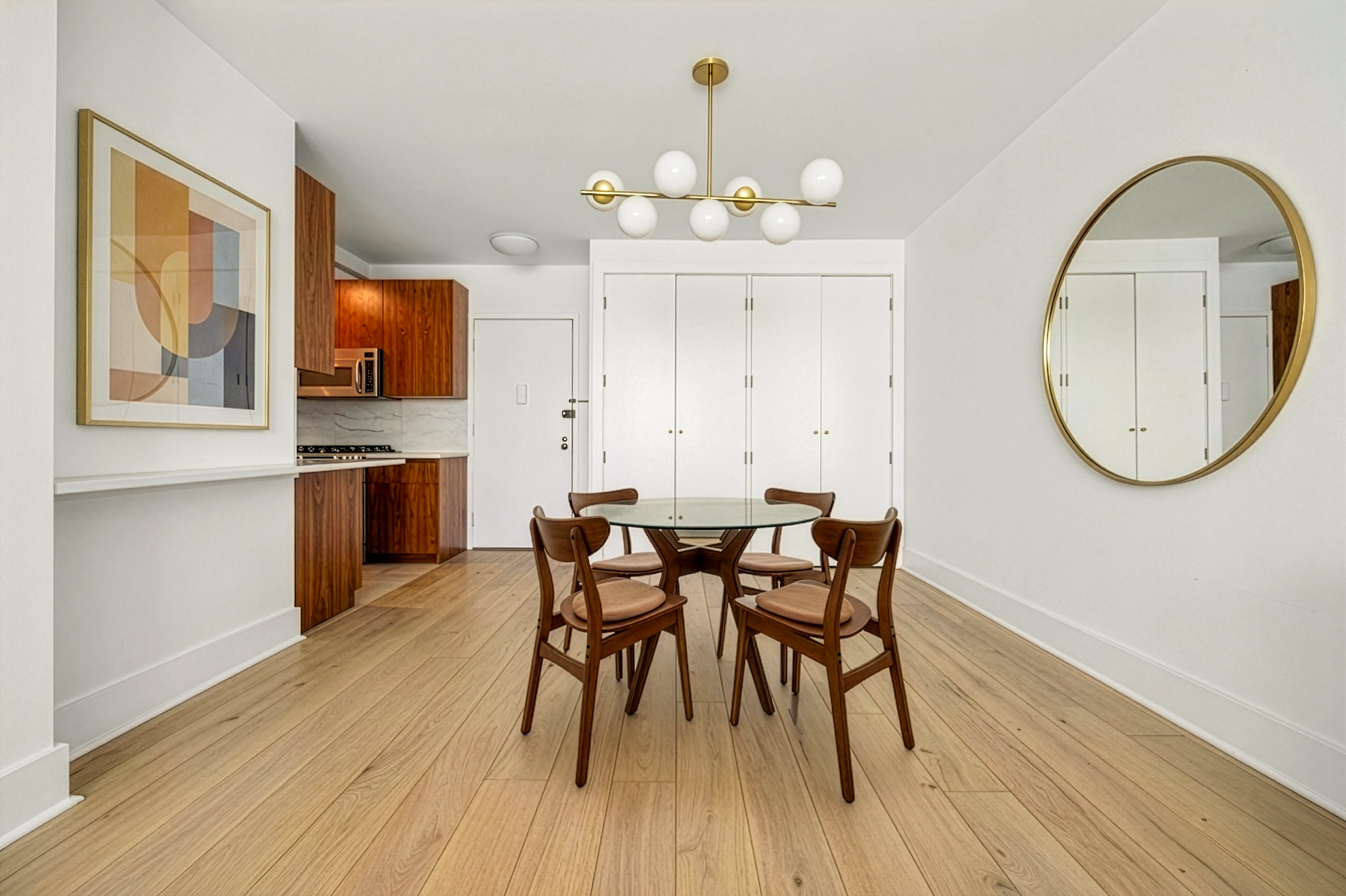 344 West 23rd Street, Unit 2B Manhattan, NY 10011 - Photo 4 of 10 a view of a dining room with furniture and wooden floor