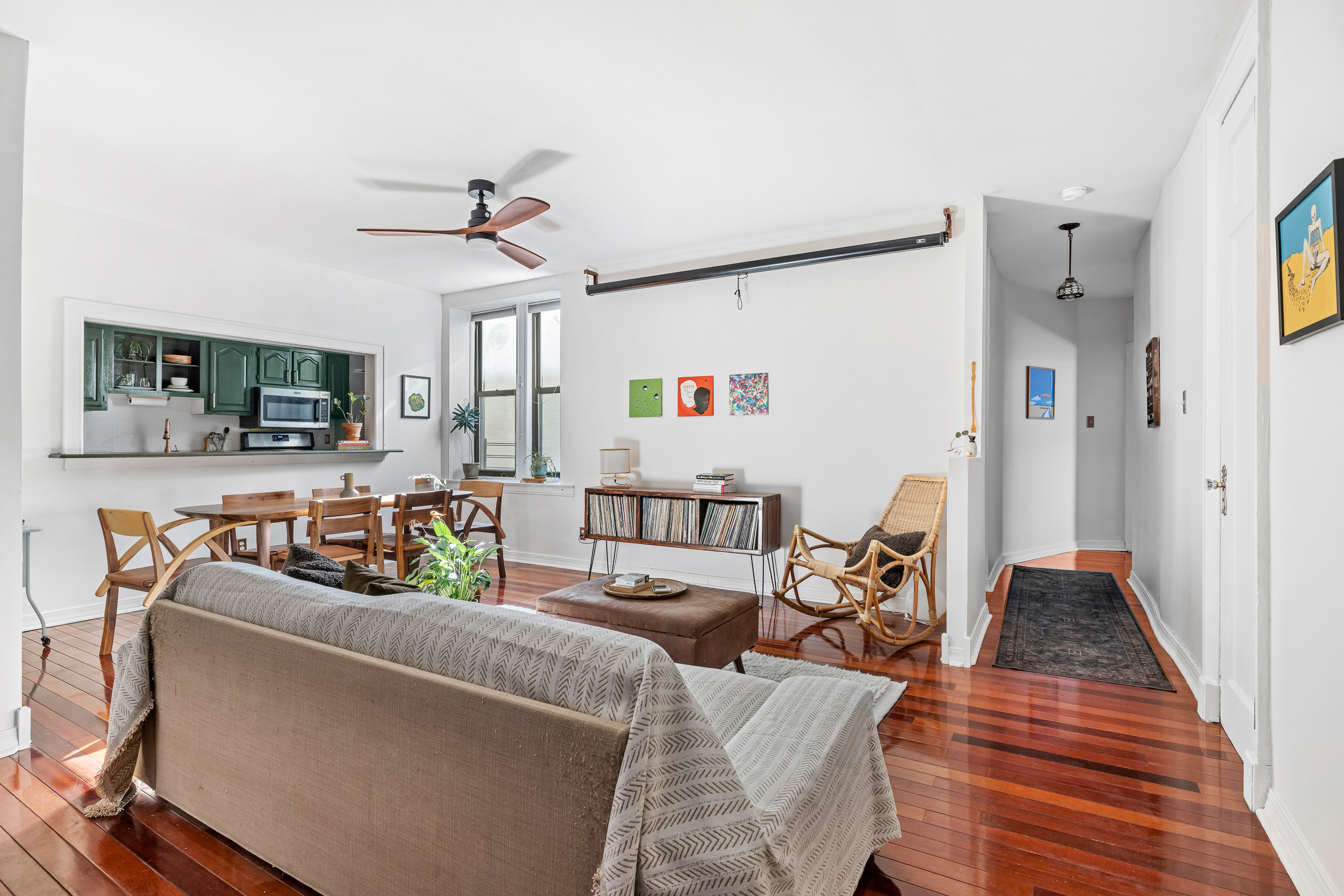 7901 4th Avenue Brooklyn, NY 11209 - Photo 5 of 10 a living room with furniture and a wooden floor