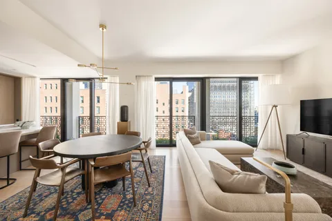 a view of a livingroom with furniture and a table