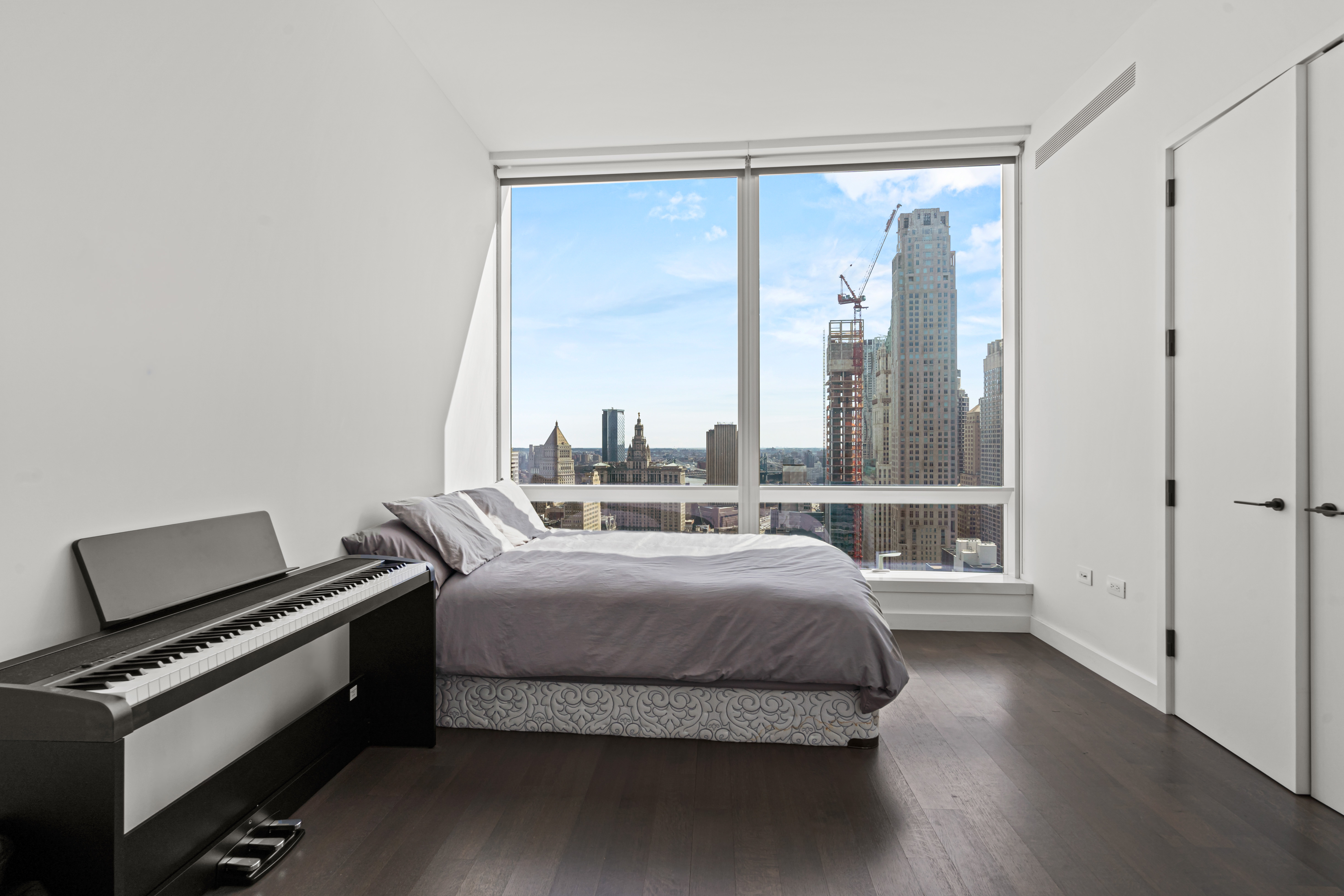 111 Murray Street, Unit 43B Manhattan, NY 10007 - Photo 12 of 17 a bedroom with a bed and a window