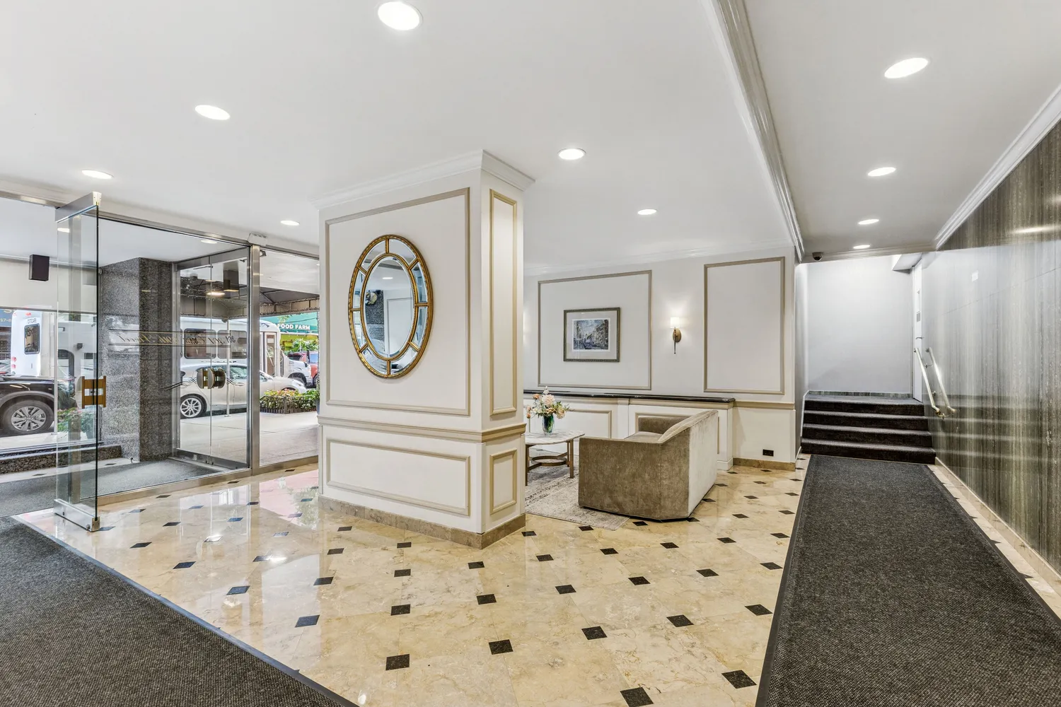 a spacious bathroom with a sink a mirror and a shower