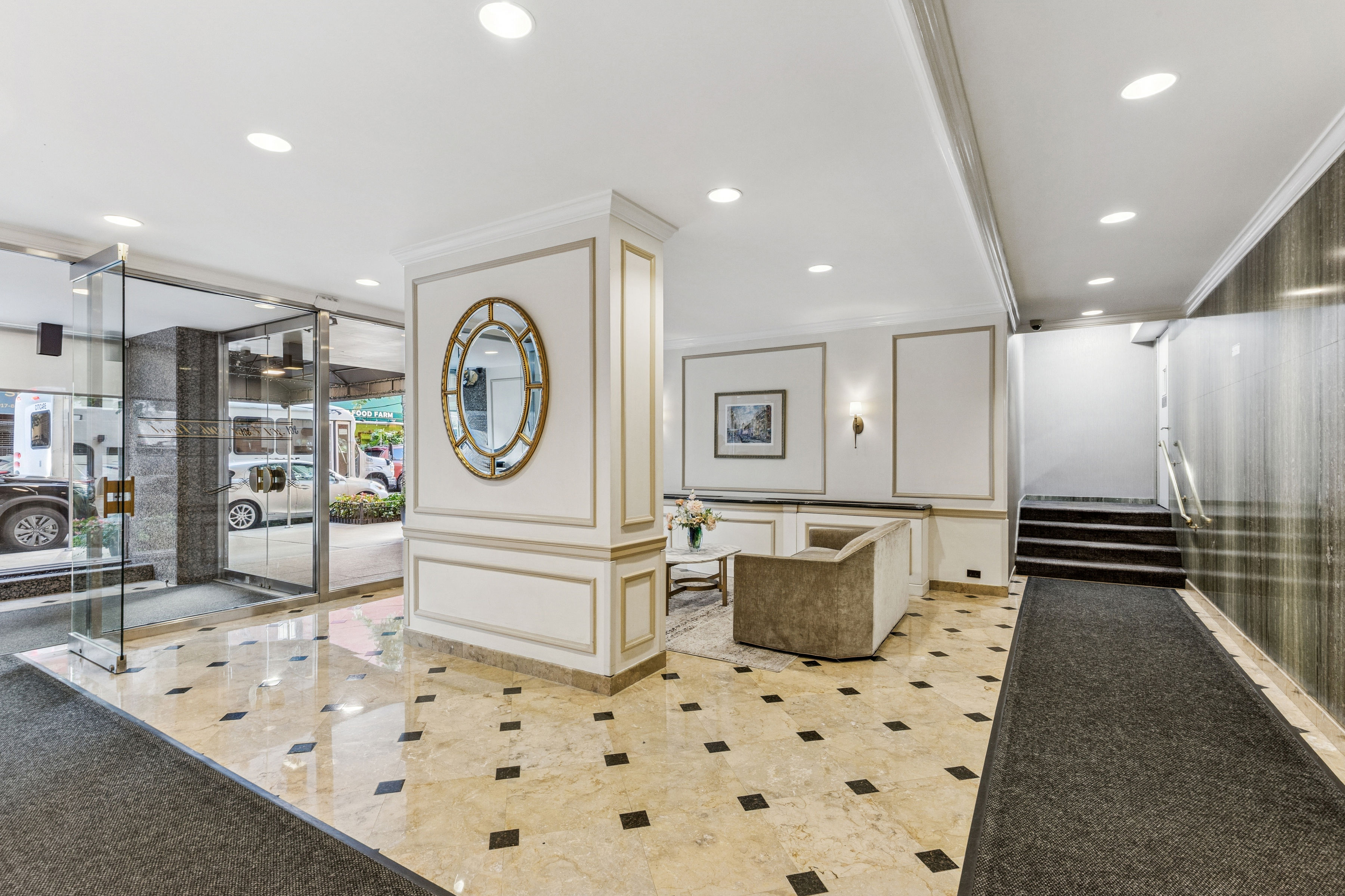 301 East 69th Street, Unit 14A Manhattan, NY 10021 - Photo 8 of 13 a spacious bathroom with a sink a mirror and a shower