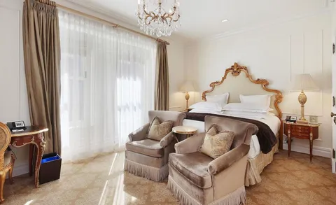 a bedroom with furniture and a flat tv screen