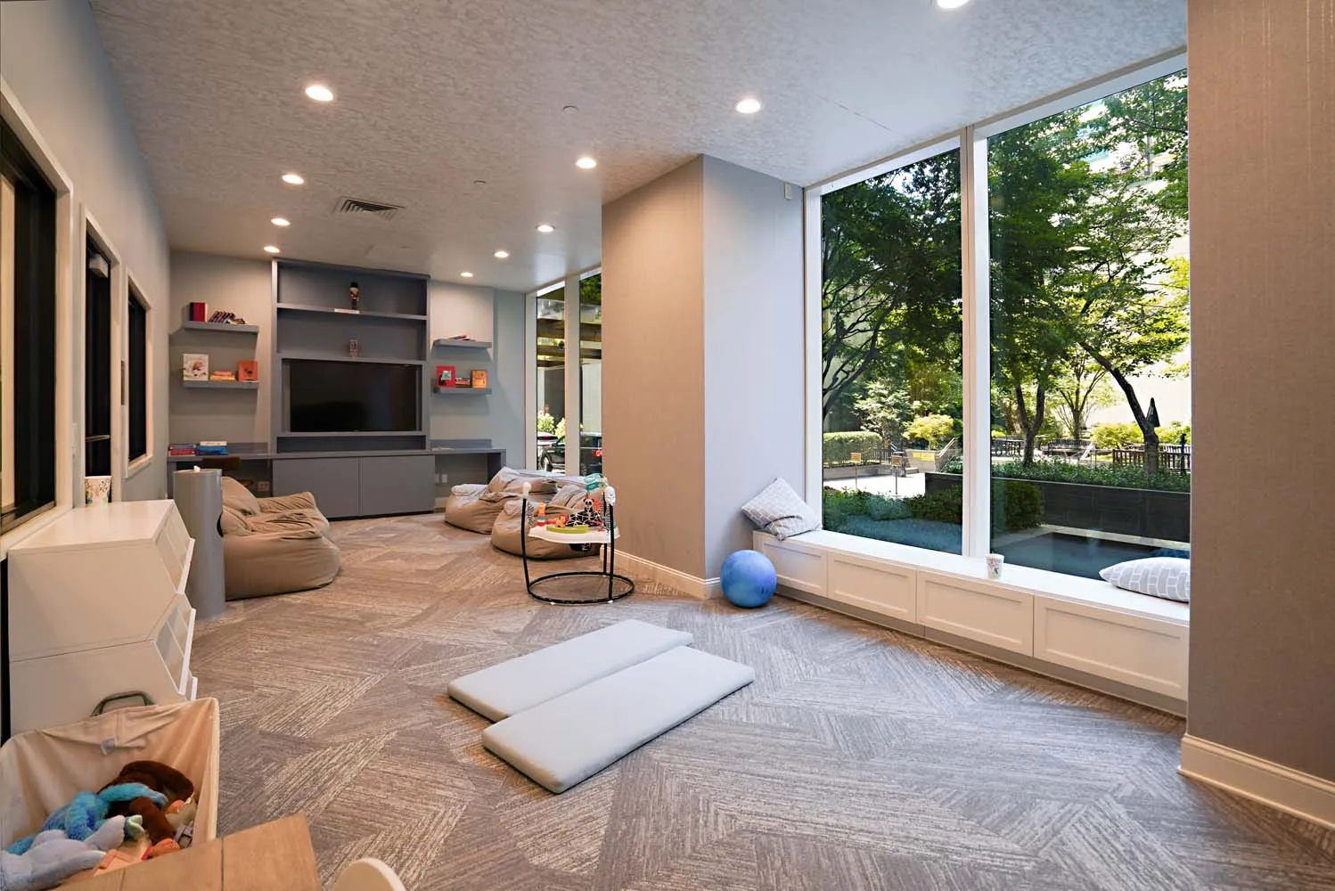 a living room with furniture and a flat screen tv