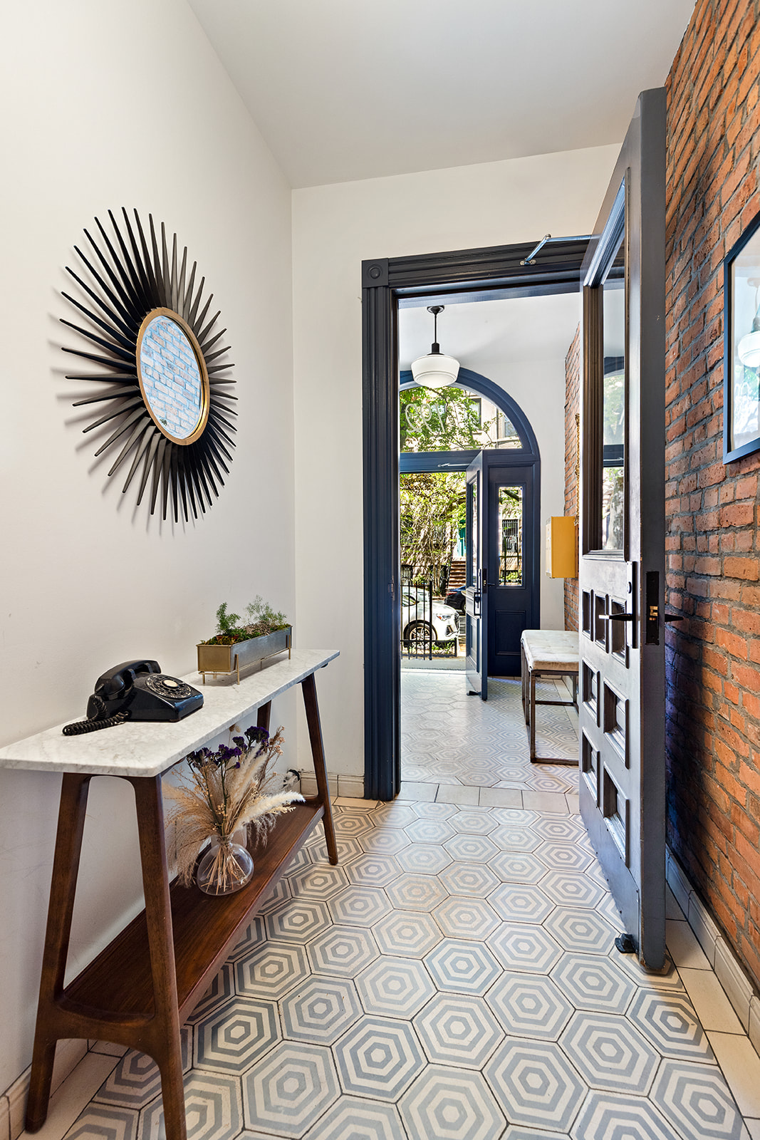 192 Saint Marks Avenue Brooklyn, NY 11238 - Photo 20 of 24 a living room with furniture and a large window