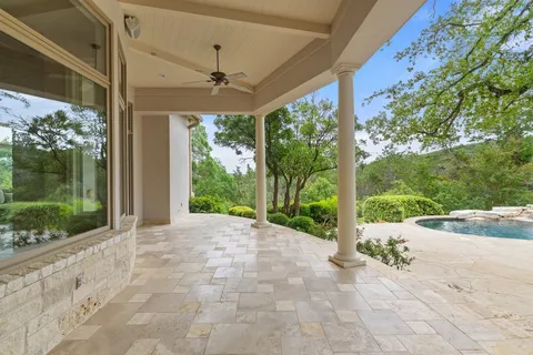 an aerial view of a house with yard