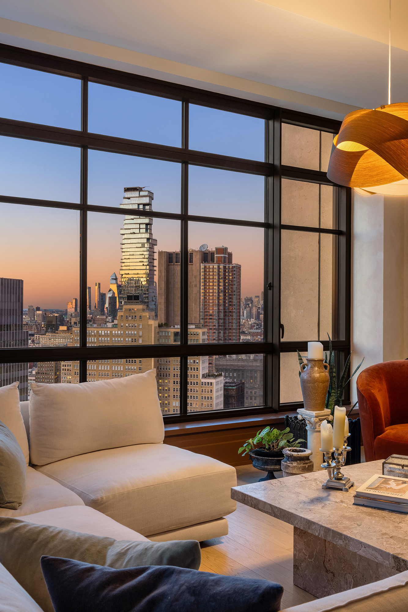 25 Park Row, Unit 29A Manhattan, NY 10038 - Photo 11 of 23 a living room with furniture water view and large windows