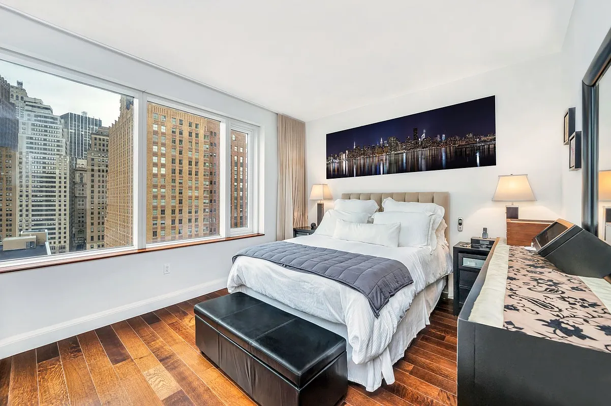 70 Little West Street, Unit 15A Manhattan, NY 10004 - Photo 7 of 19 a bedroom with a bed and window