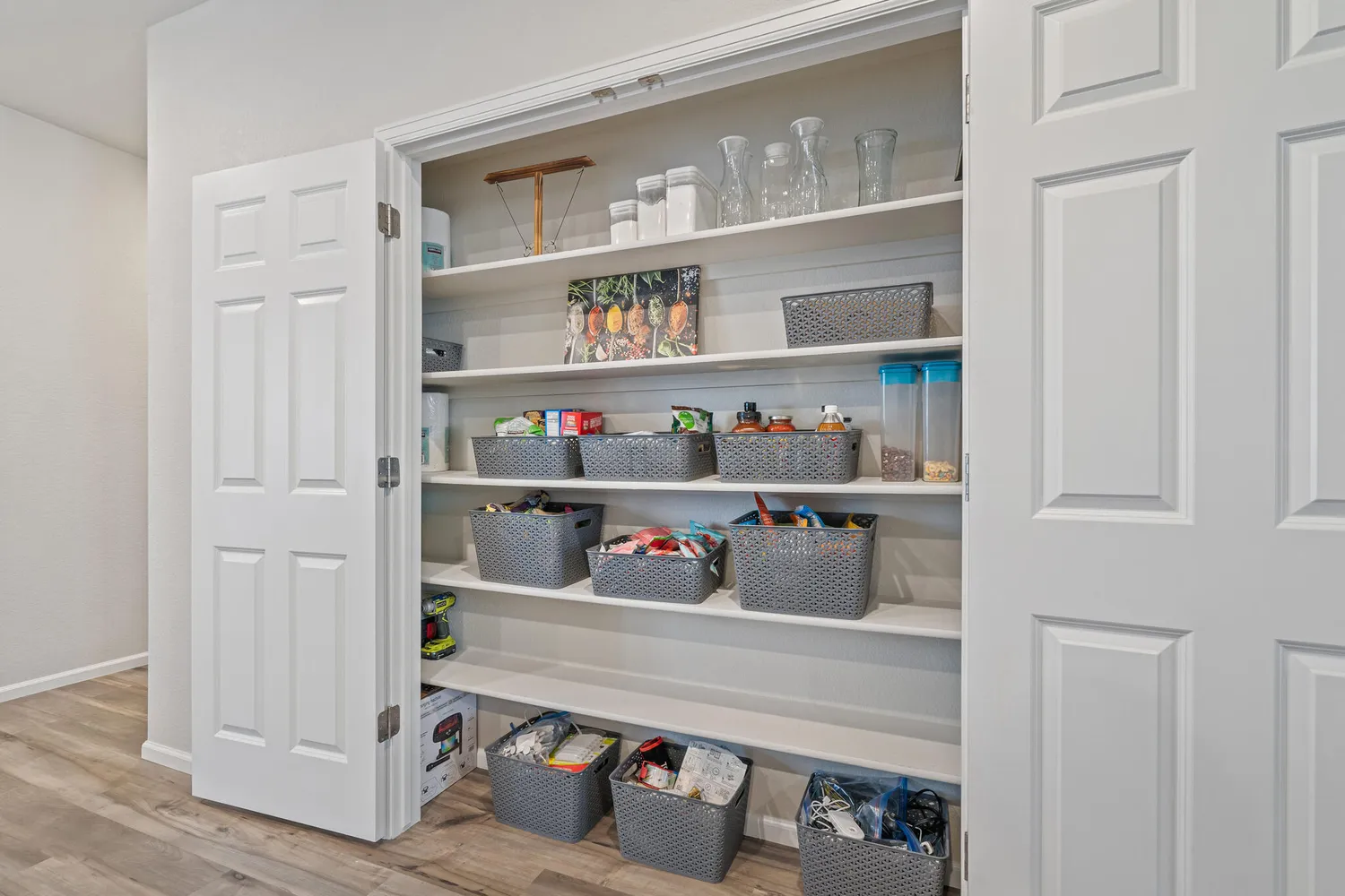a room with a wooden floor and shelf