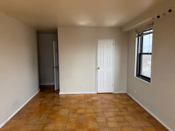 a view of an empty room with a window