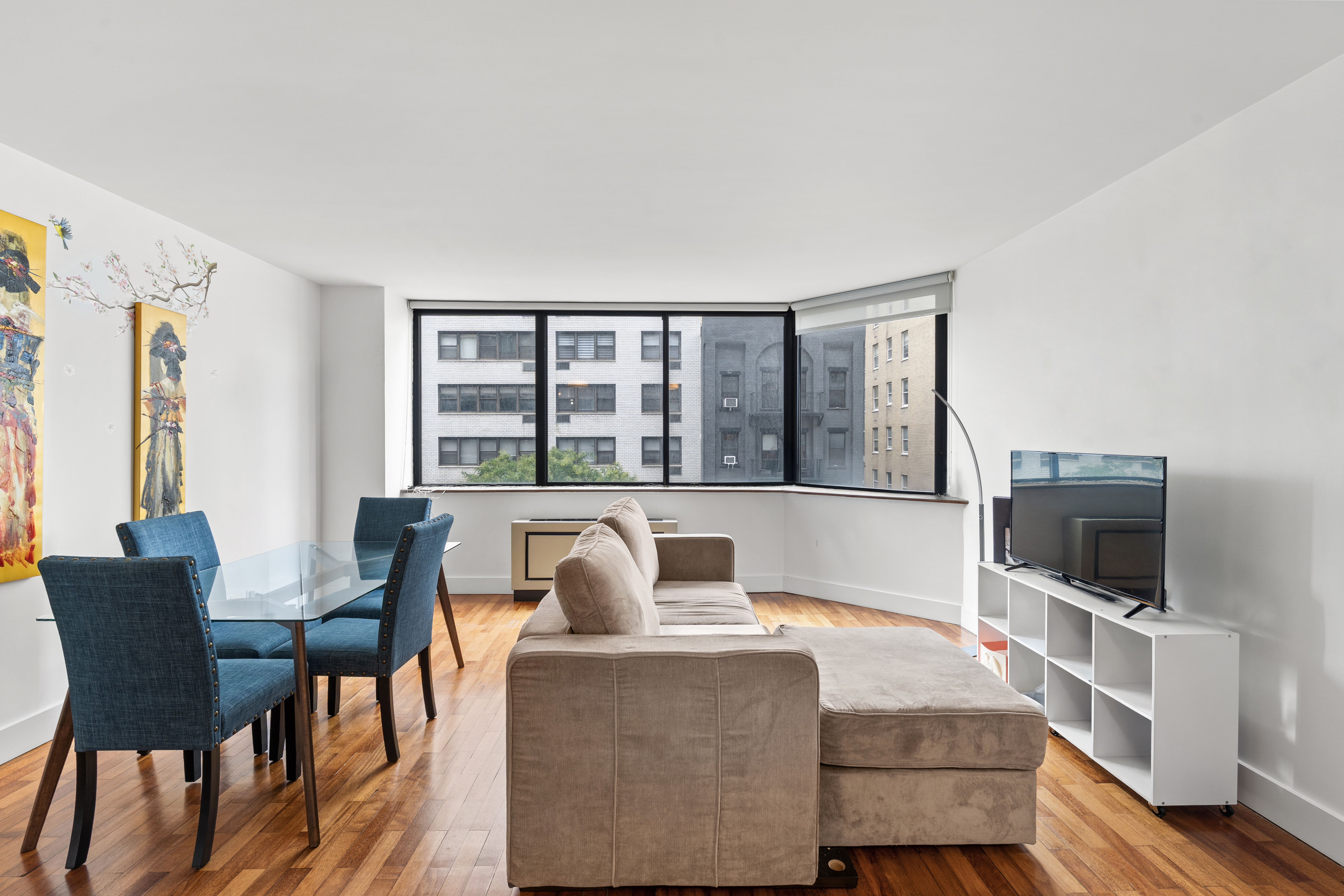 a living room with furniture and a flat screen tv