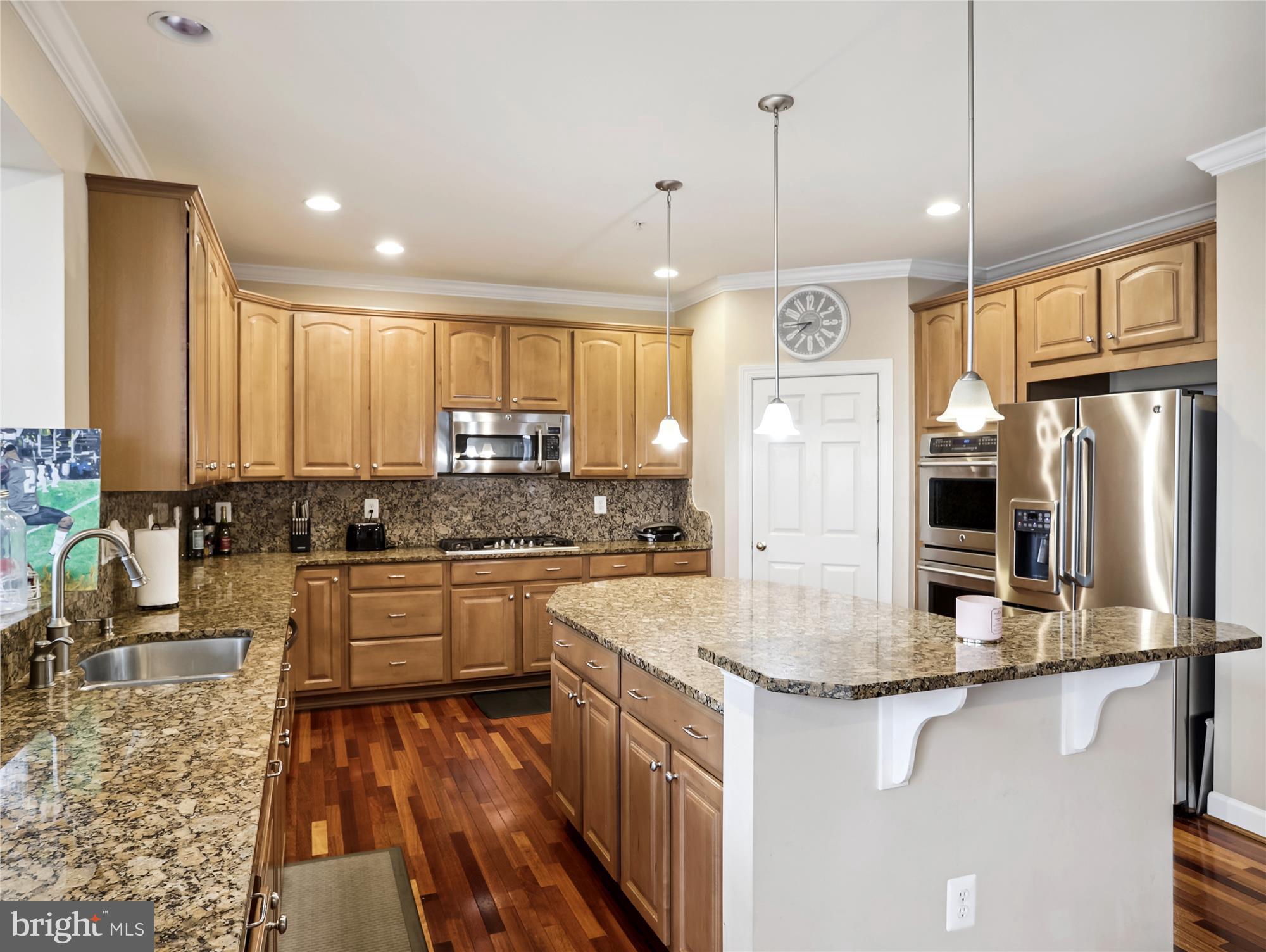 14302 Derby Ridge Road Bowie, MD 20721 - Photo 16 of 67 a kitchen with stainless steel appliances granite countertop a sink stove and refrigerator