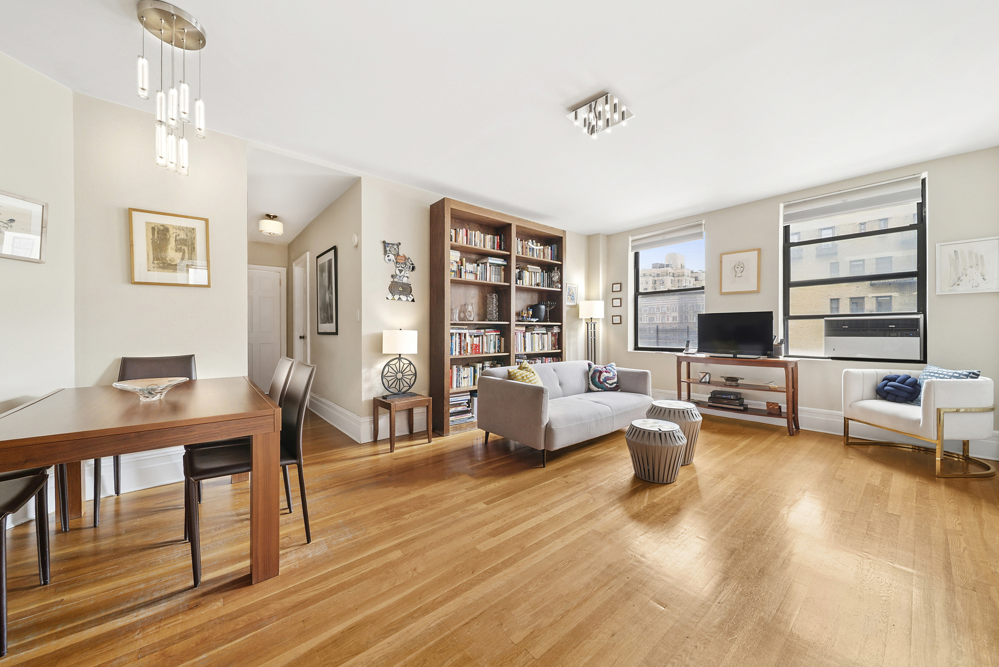 514 West End Avenue, Unit 14A Manhattan, NY 10024 - Photo 1 of 9 a living room with furniture and a flat screen tv