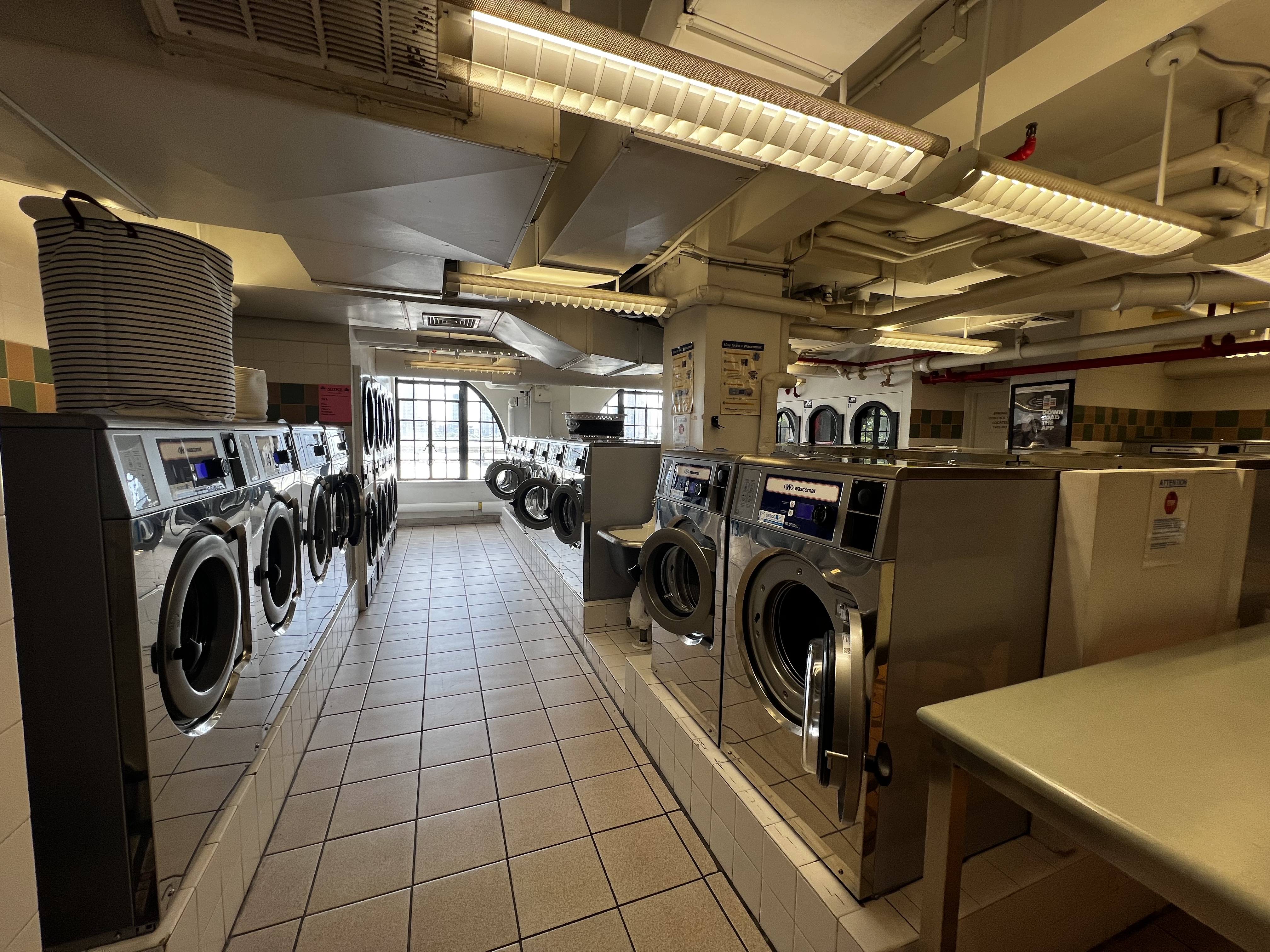 5 Tudor City Place, Unit 1536 Manhattan, NY 10017 - Photo 19 of 21 a view of a storage & utility room with washer and dryer