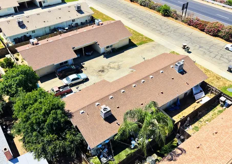 an aerial view of house with yard