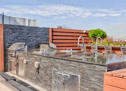 a backyard of a house with seating space