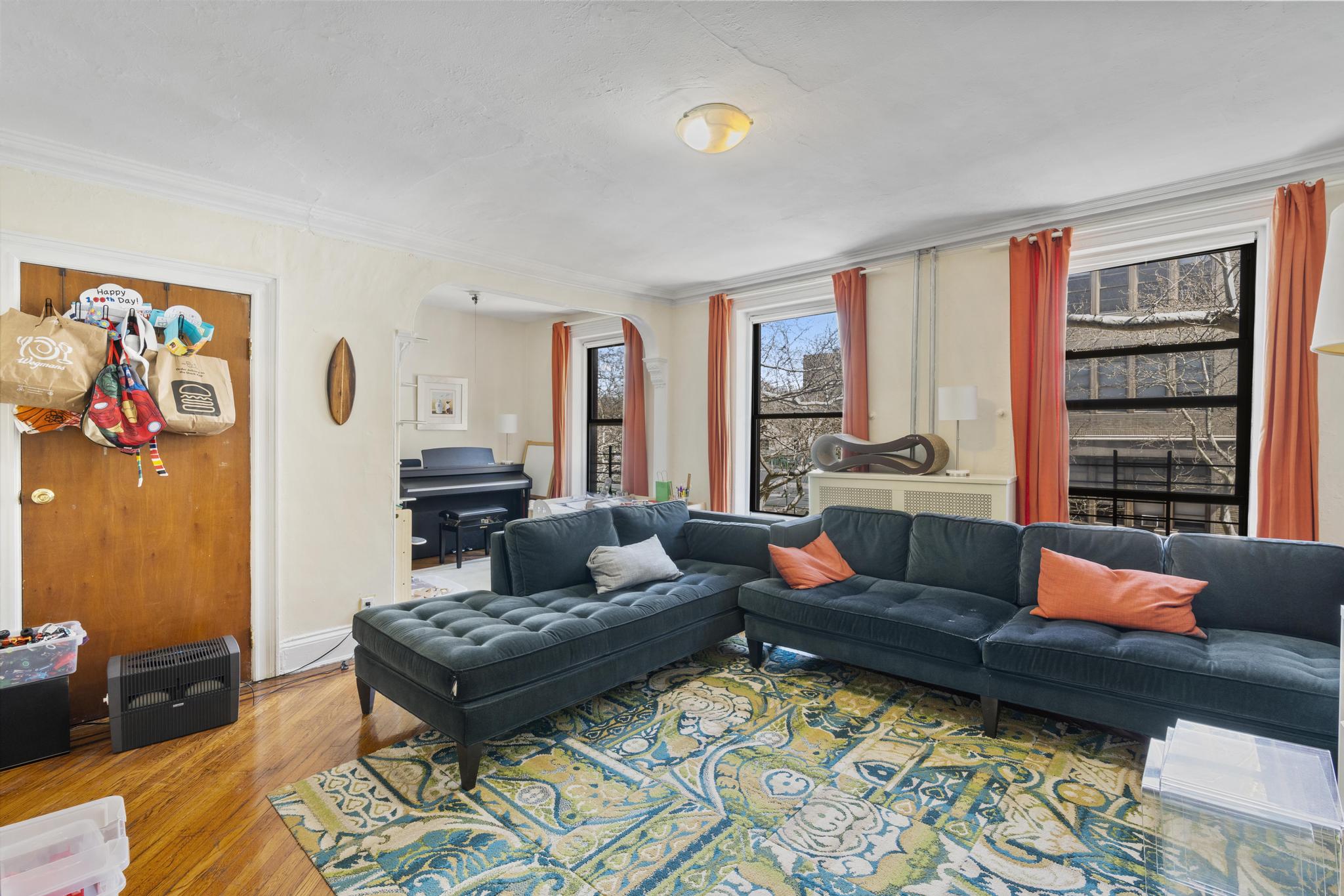 364 Clermont Avenue Brooklyn, NY 11238 - Photo 13 of 18 a living room with furniture and a rug
