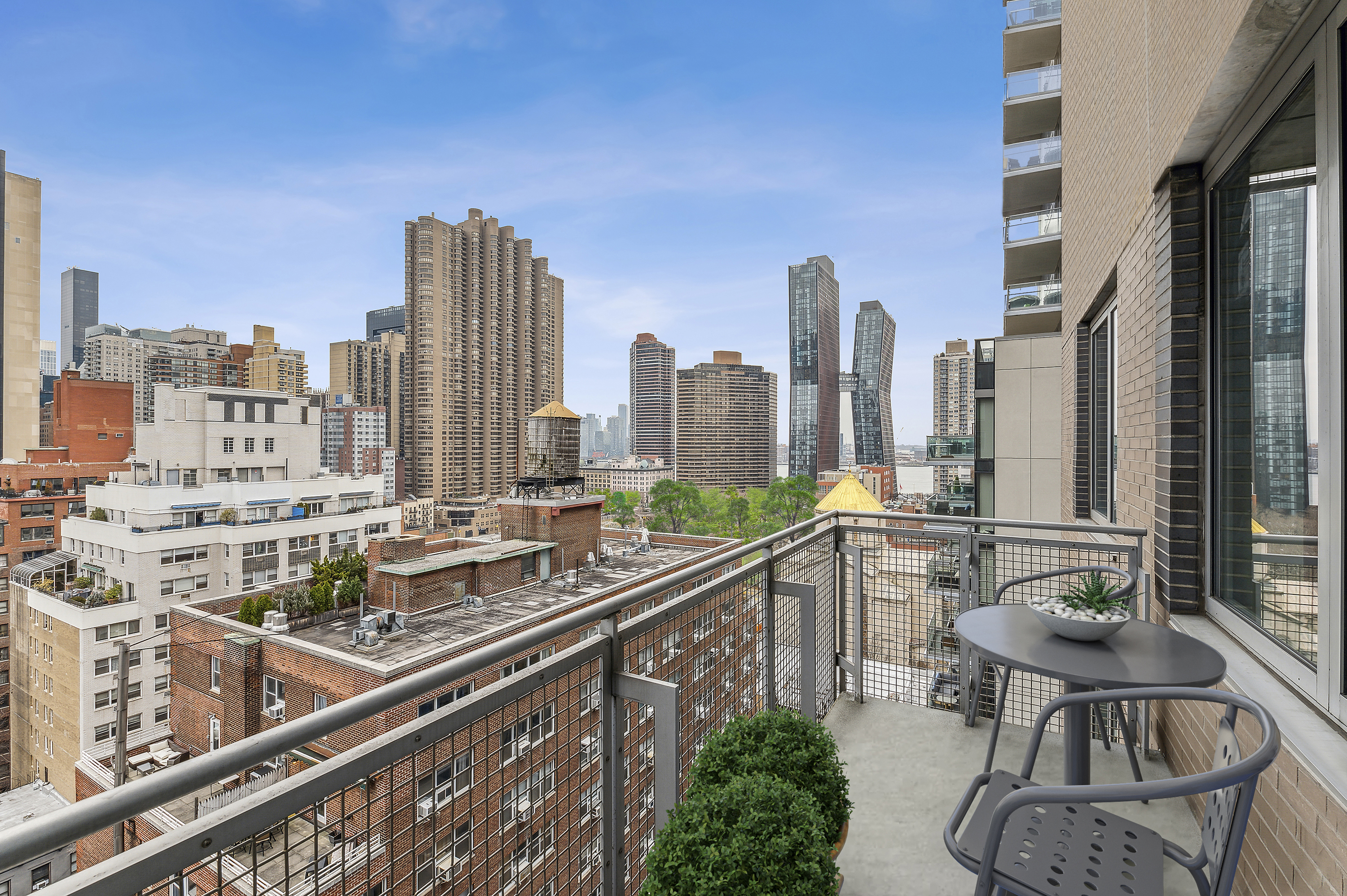 225 East 34th Street, Unit 14J Manhattan, NY 10016 - Photo 3 of 19 a view of balcony with chairs and iron fence