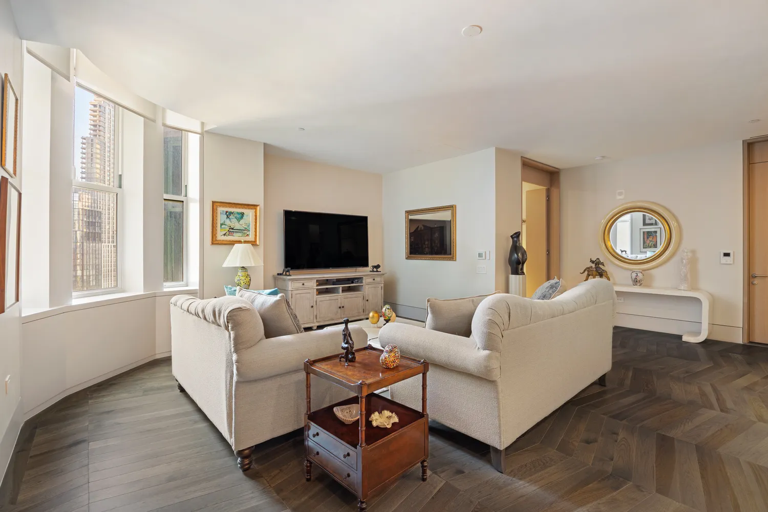 a living room with furniture and a flat screen tv