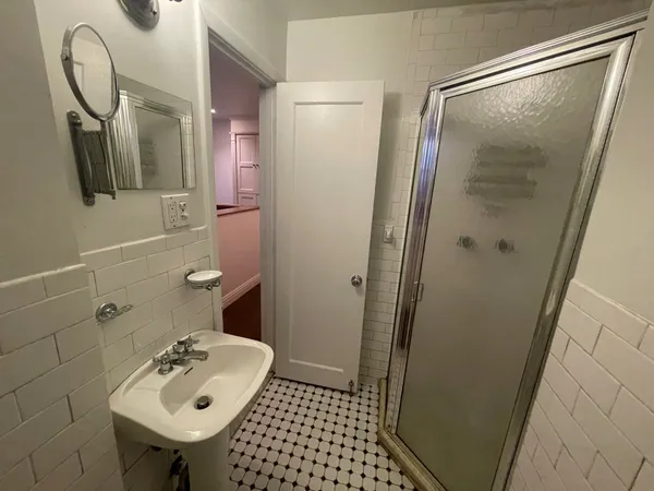 a large kitchen with a stove and a refrigerator