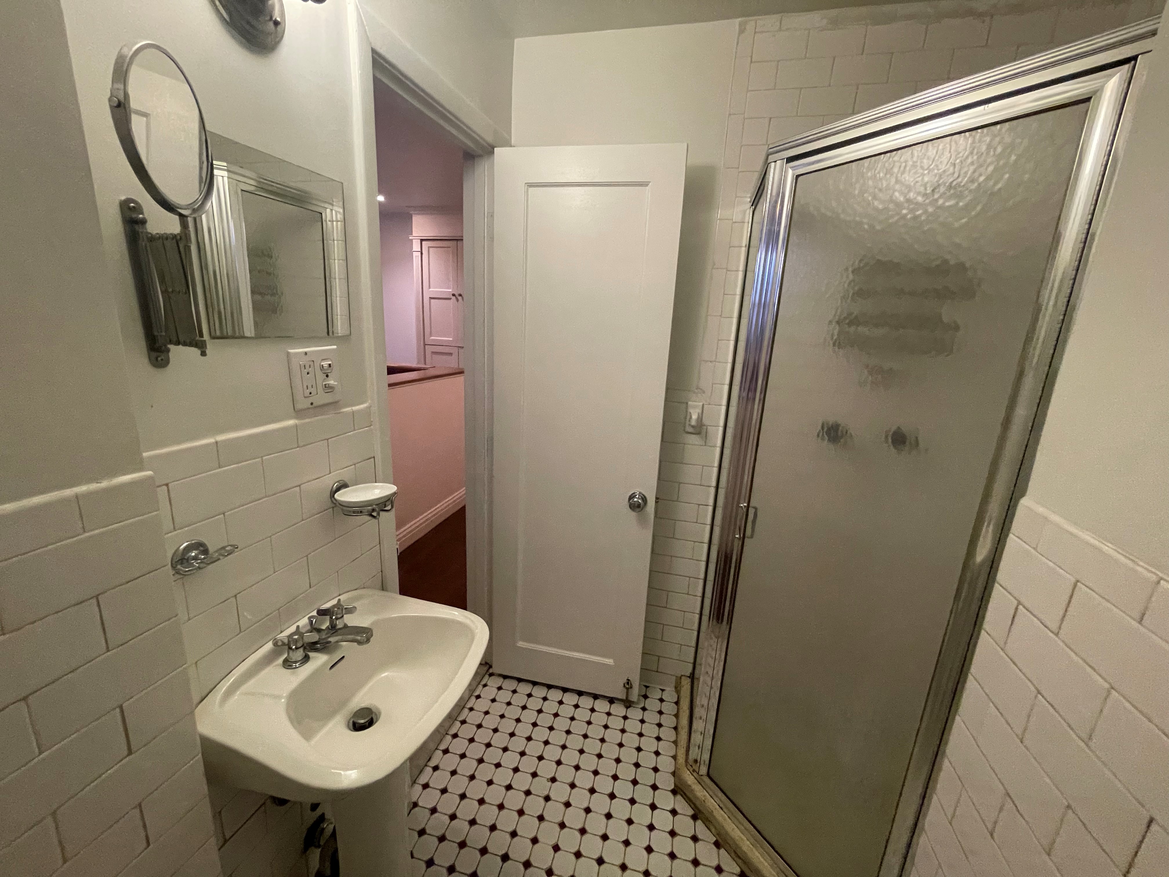 120 East 10th Street, Unit 1 Manhattan, NY 10003 - Photo 10 of 24 a bathroom with a sink a toilet and shower