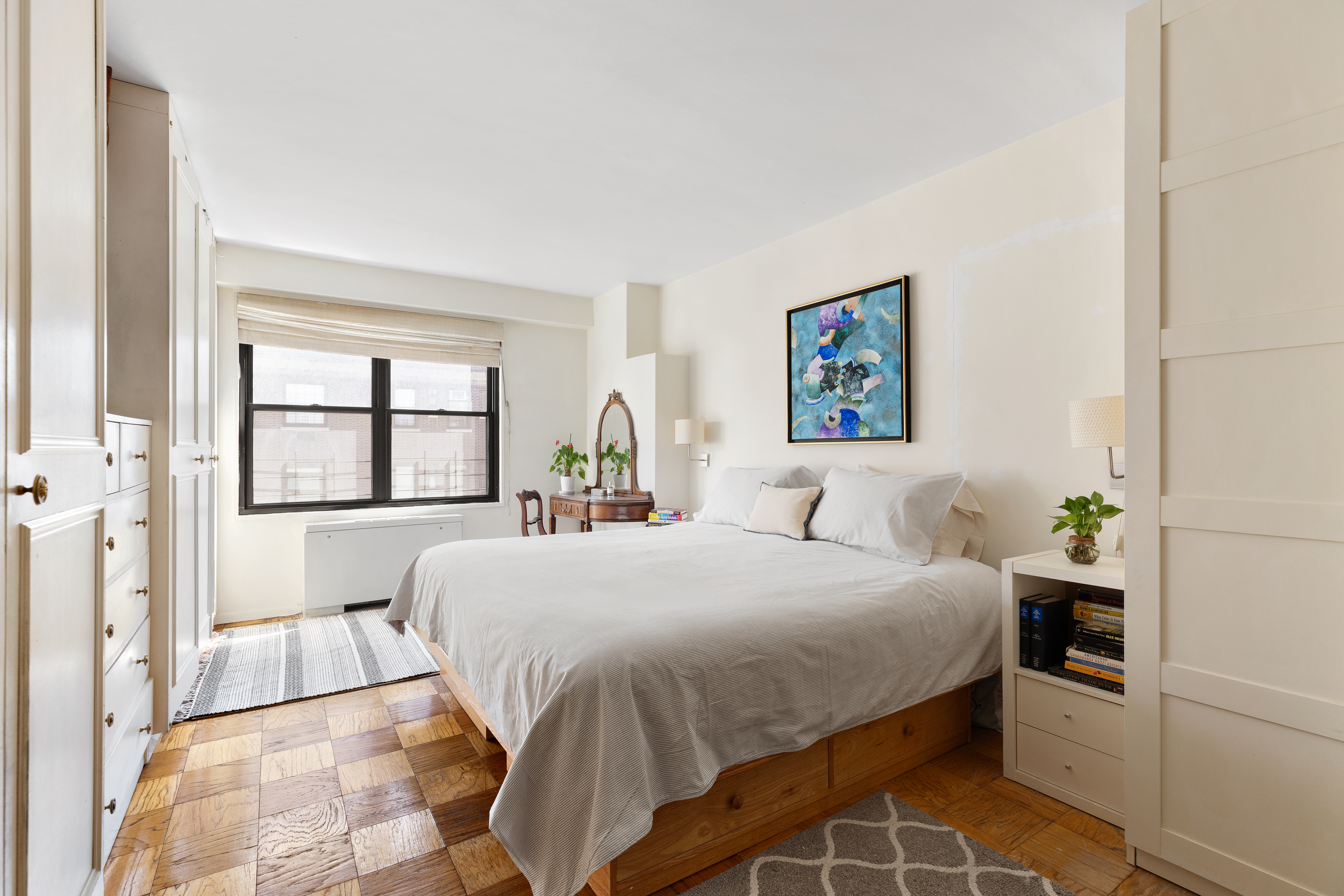 120 East 90th Street, Unit 9E Manhattan, NY 10128 - Photo 6 of 9 a bedroom with a bed and a window