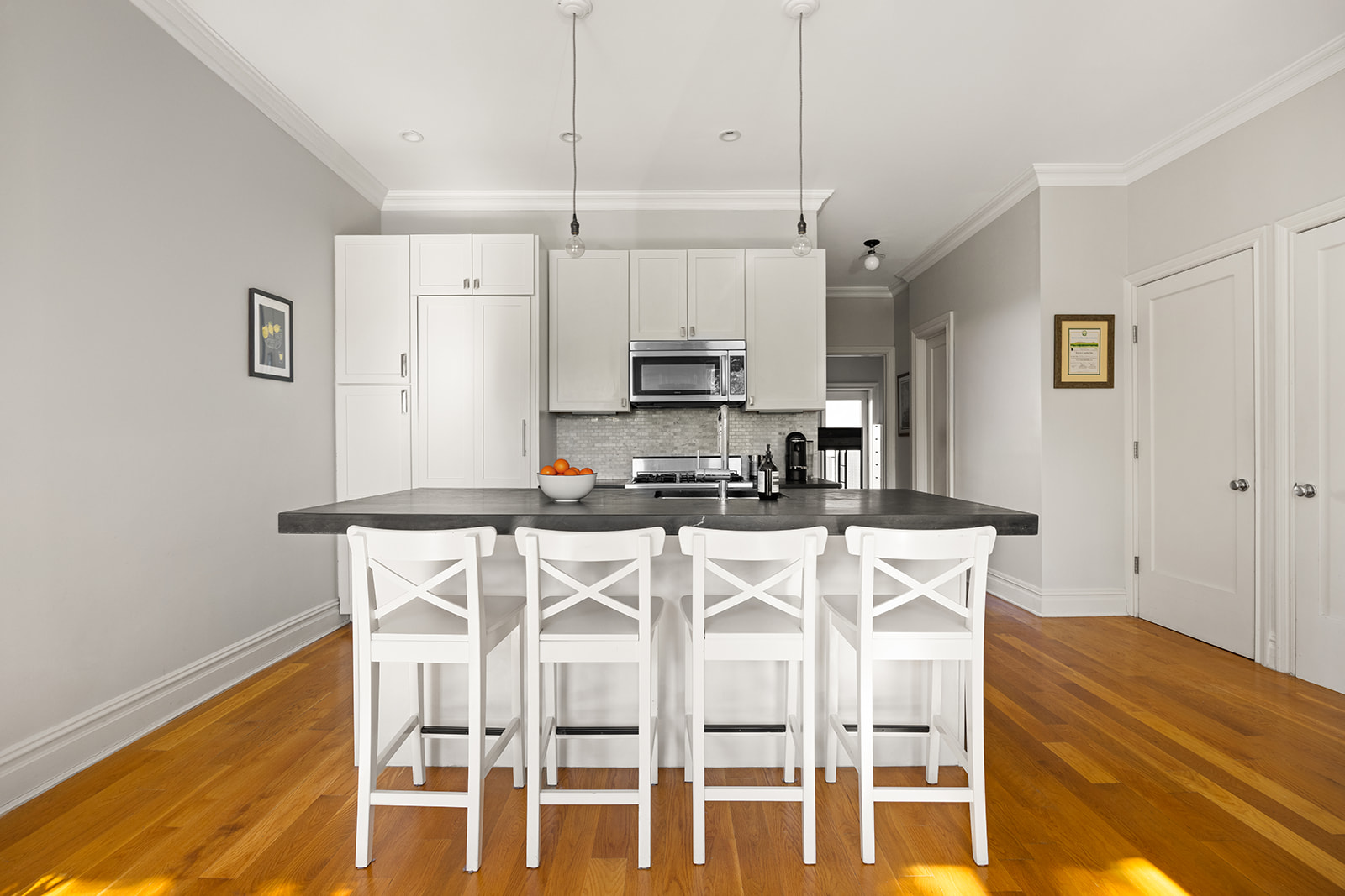 493 18th Street, Unit 2 Brooklyn, NY 11215 - Photo 4 of 13 a kitchen with stainless steel appliances granite countertop a sink a stove a refrigerator with white cabinets and wooden floor