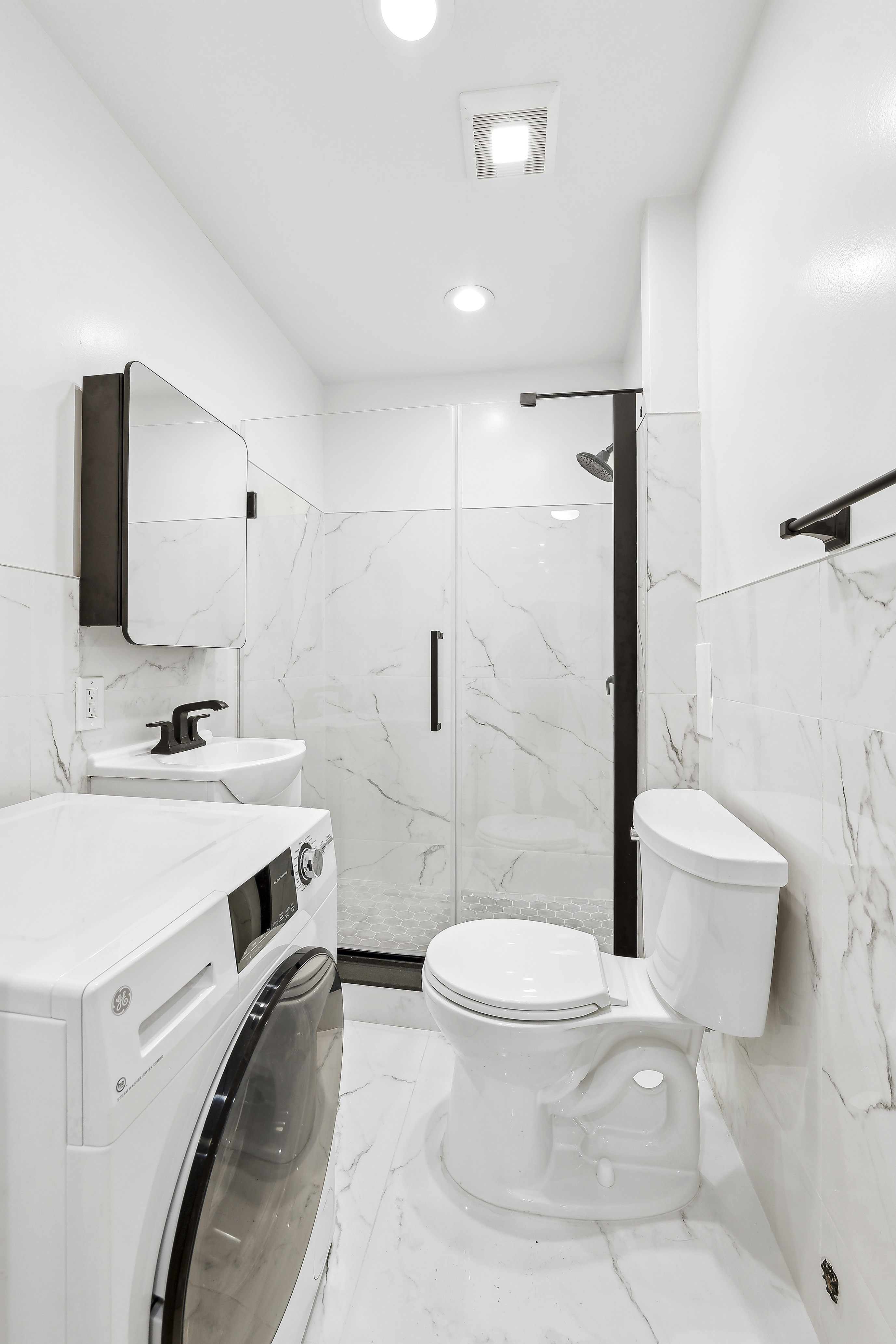 398 3rd Avenue, Unit 4B Manhattan, NY 10016 - Photo 7 of 10 a bathroom with a sink toilet and shower