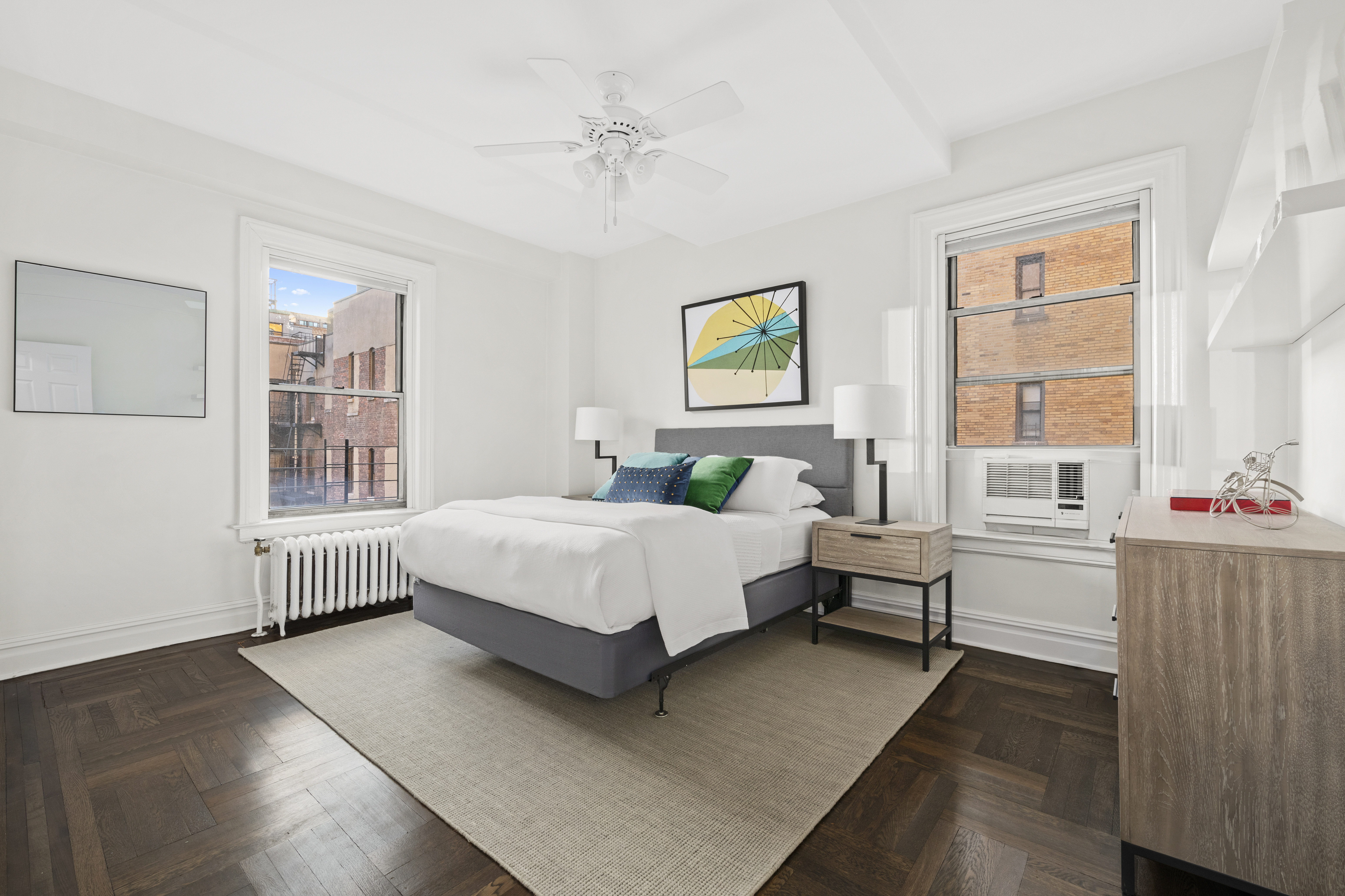 328 West 86th Street, Unit 6A Manhattan, NY 10024 - Photo 4 of 10 a bedroom with a bed wooden floor and window