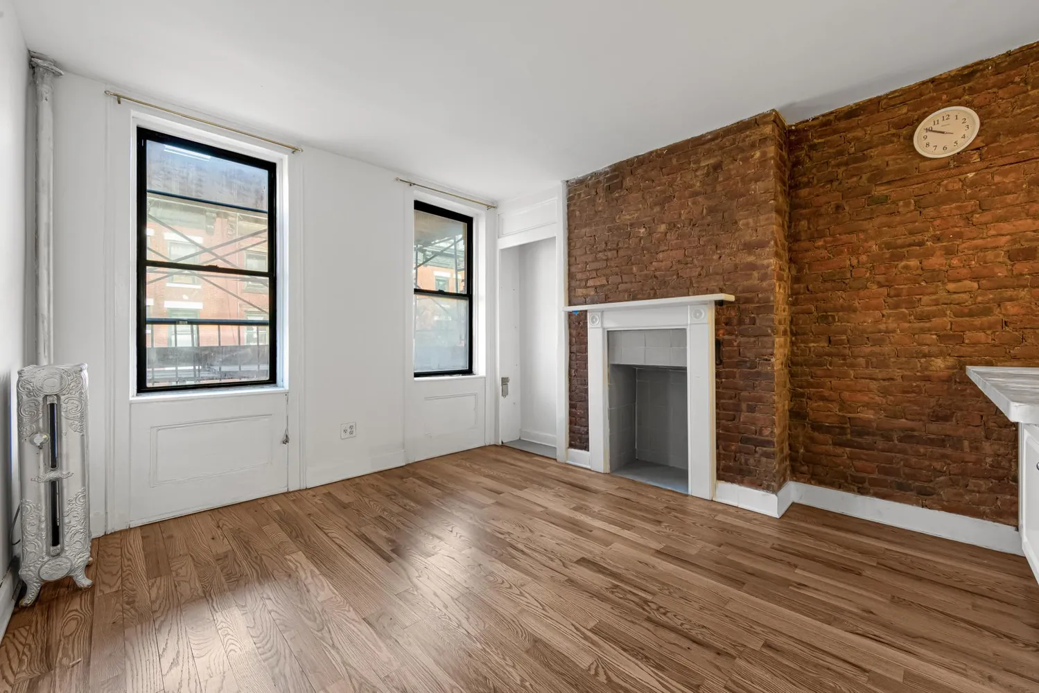 an empty room with windows and closet