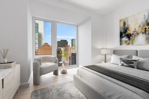 a bedroom with a large bed and a couch