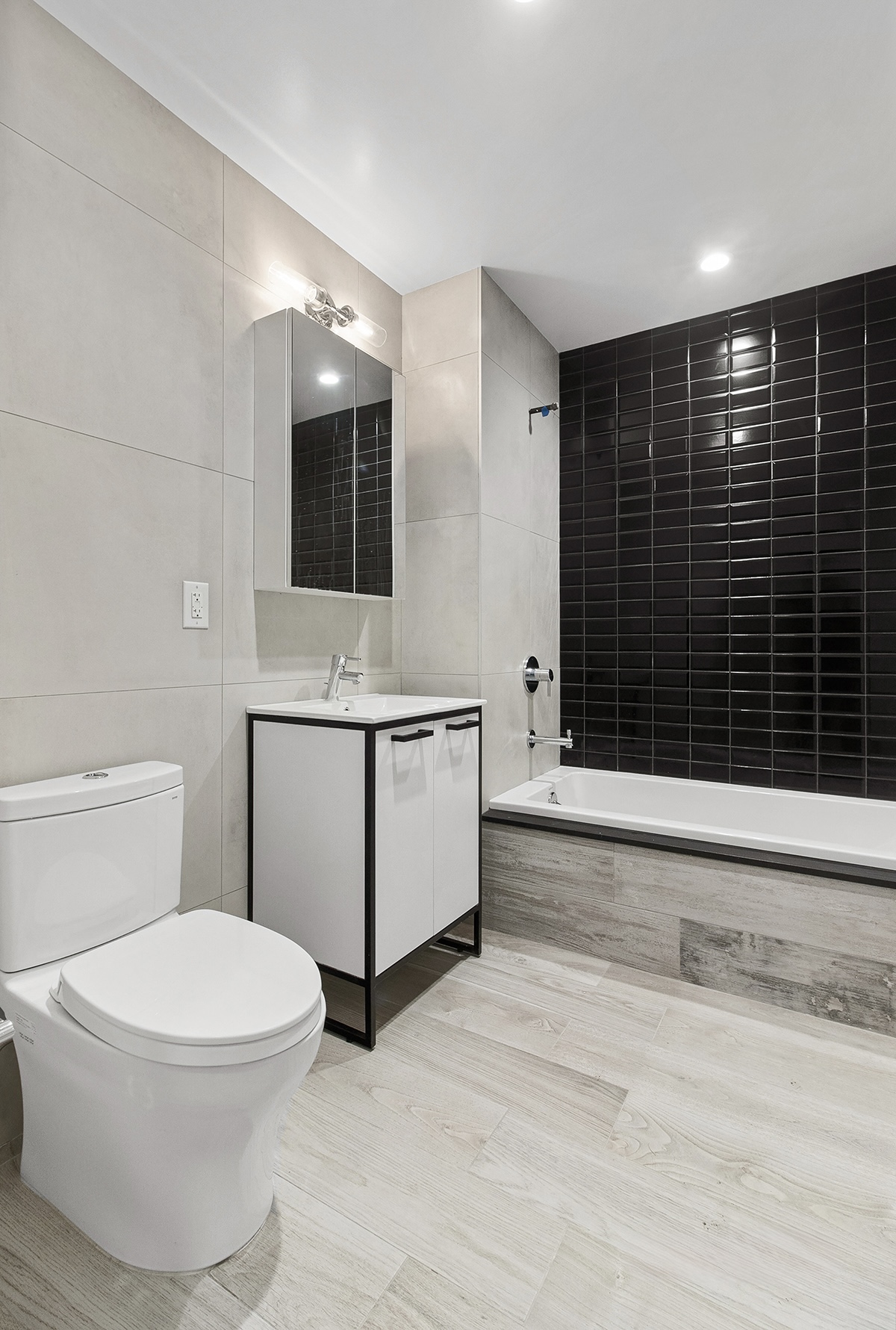 1098 Madison Street, Unit 1B Brooklyn, NY 11221 - Photo 13 of 16 a bathroom with a toilet a sink and mirror