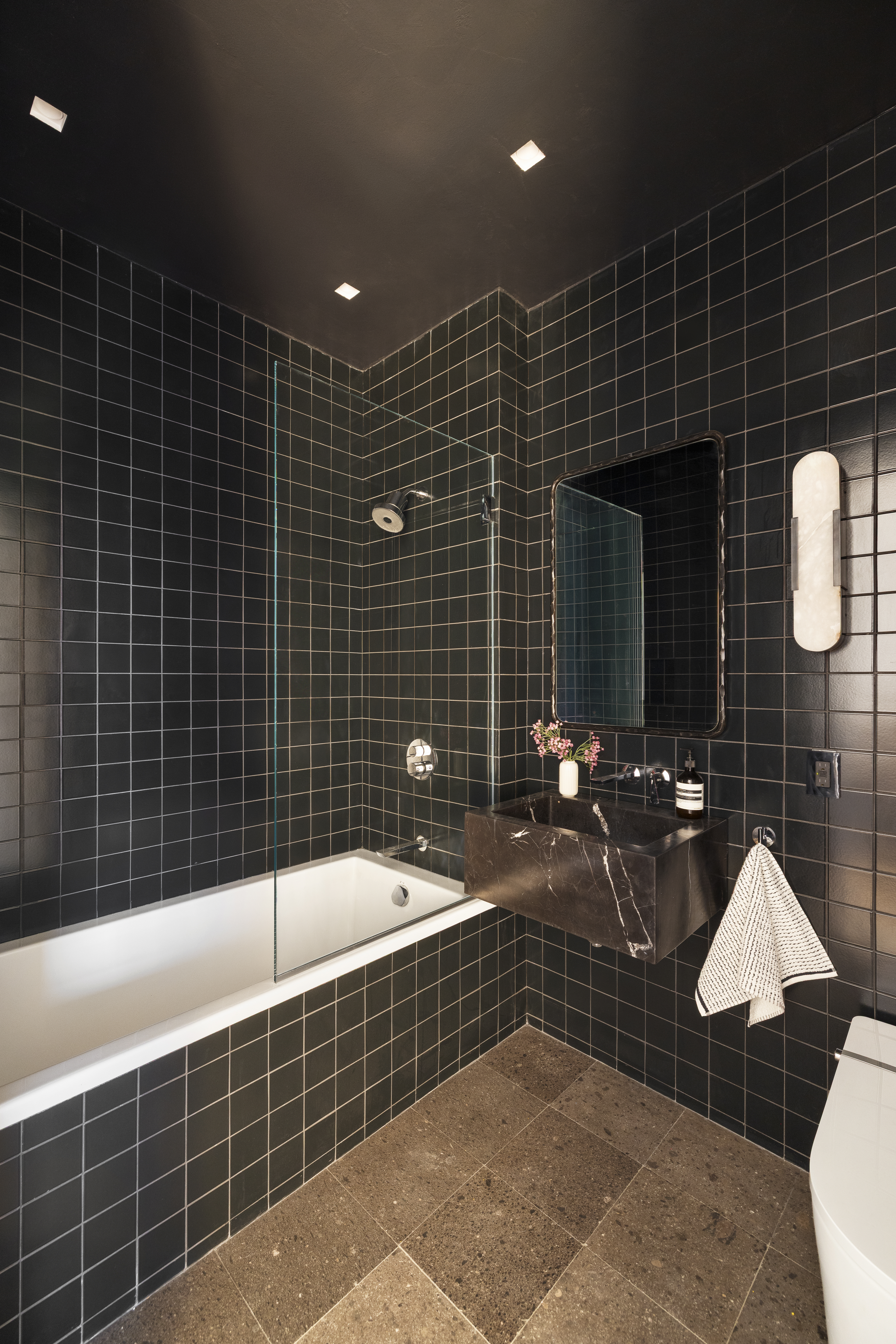 52 East 4th Street, Unit PH3 Manhattan, NY 10003 - Photo 15 of 22 a bathroom with a sink mirror and tub