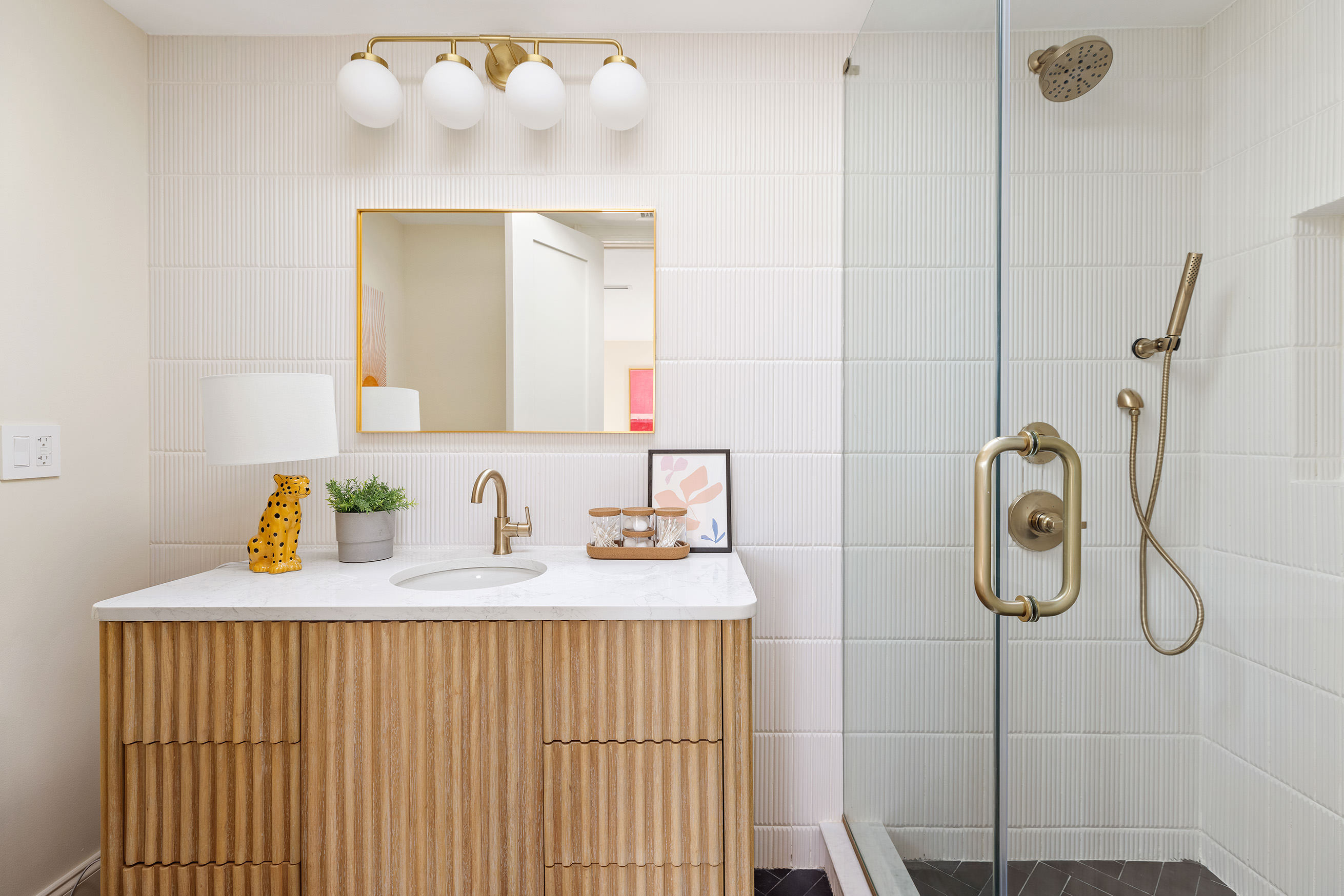 198 Madison Street, Unit SF Brooklyn, NY 11216 - Photo 13 of 19 a bathroom with a sink mirror and vanity