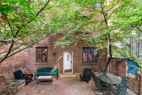 a backyard of a house with seating space