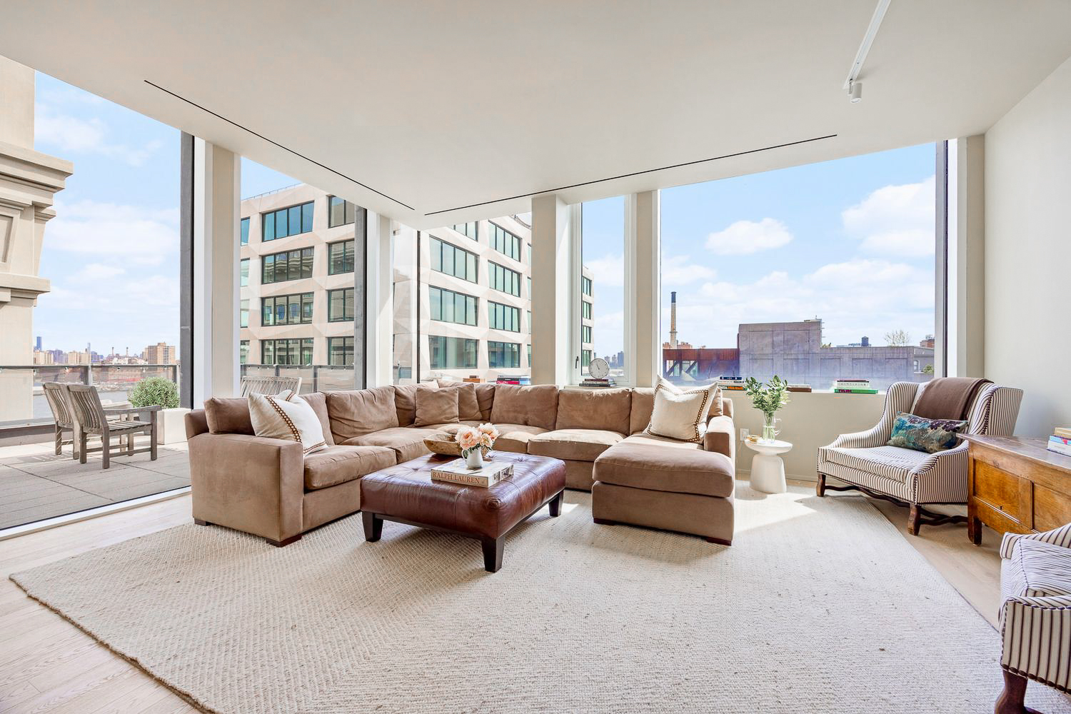 168 Plymouth Street, Unit PHC Brooklyn, NY 11201 - Photo 3 of 19 a living room with furniture and a large window