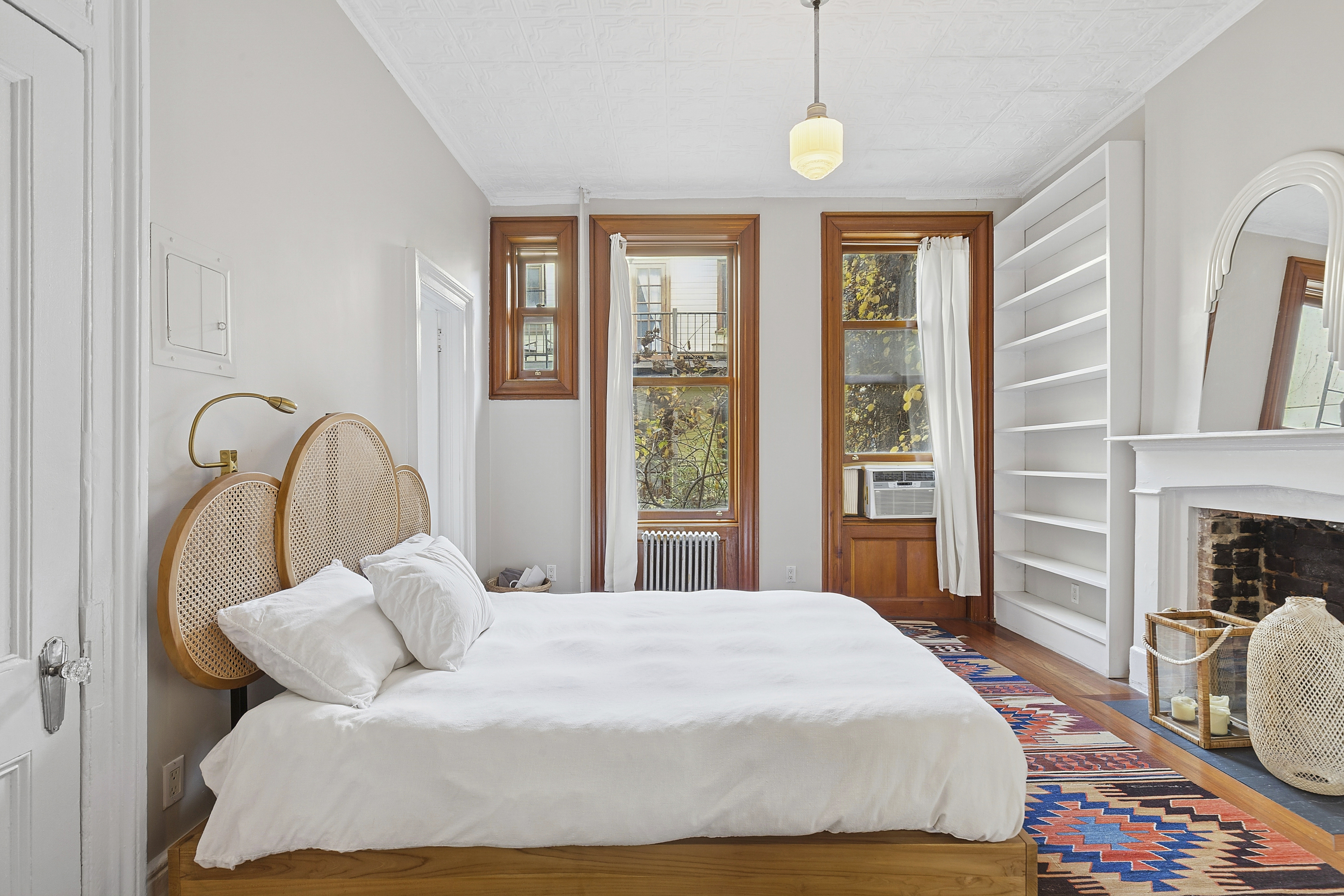 111 North 8th Street, Unit 1 Brooklyn, NY 11249 - Photo 3 of 5 a bedroom with a bed and a flat screen tv