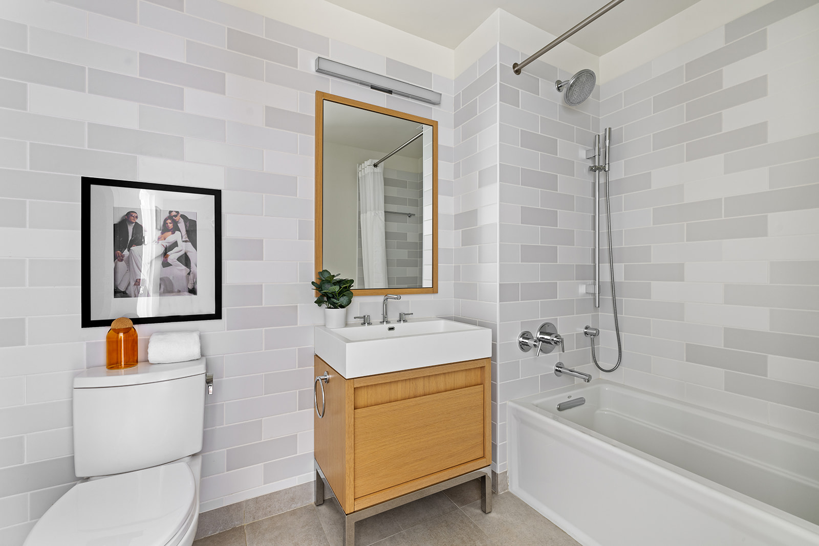 550 Vanderbilt Avenue, Unit 1402 Brooklyn, NY 11238 - Photo 9 of 17 a bathroom with a toilet a sink and a bathtub