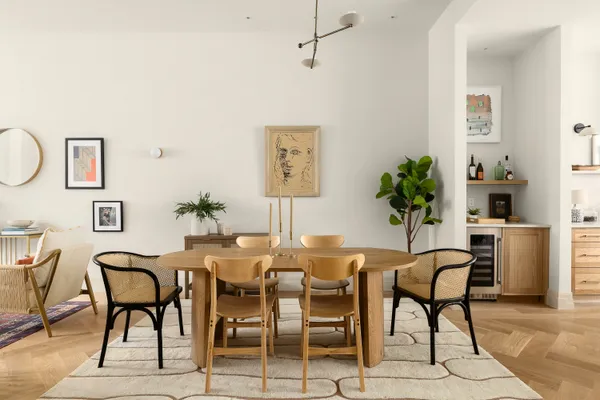 a dining room with furniture and window