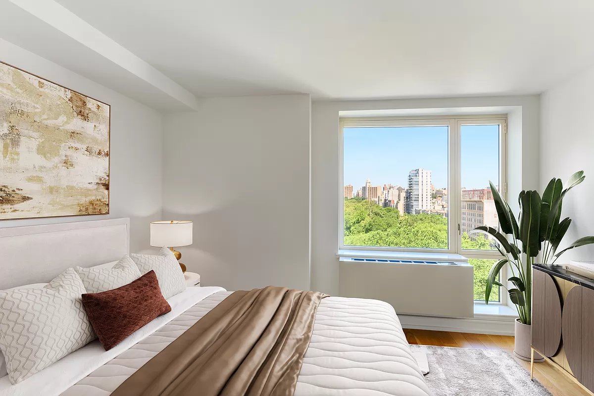1280 5th Avenue, Unit 10A Manhattan, NY 10029 - Photo 5 of 15 a bedroom with a bed and a potted plant