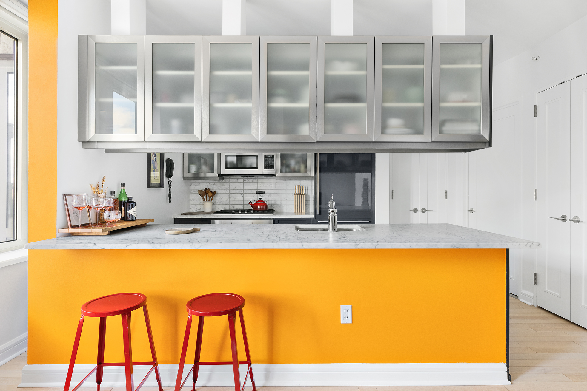 80 Riverside Boulevard, Unit 12D Manhattan, NY 10069 - Photo 3 of 16 a kitchen with stainless steel appliances granite countertop a sink and cabinets