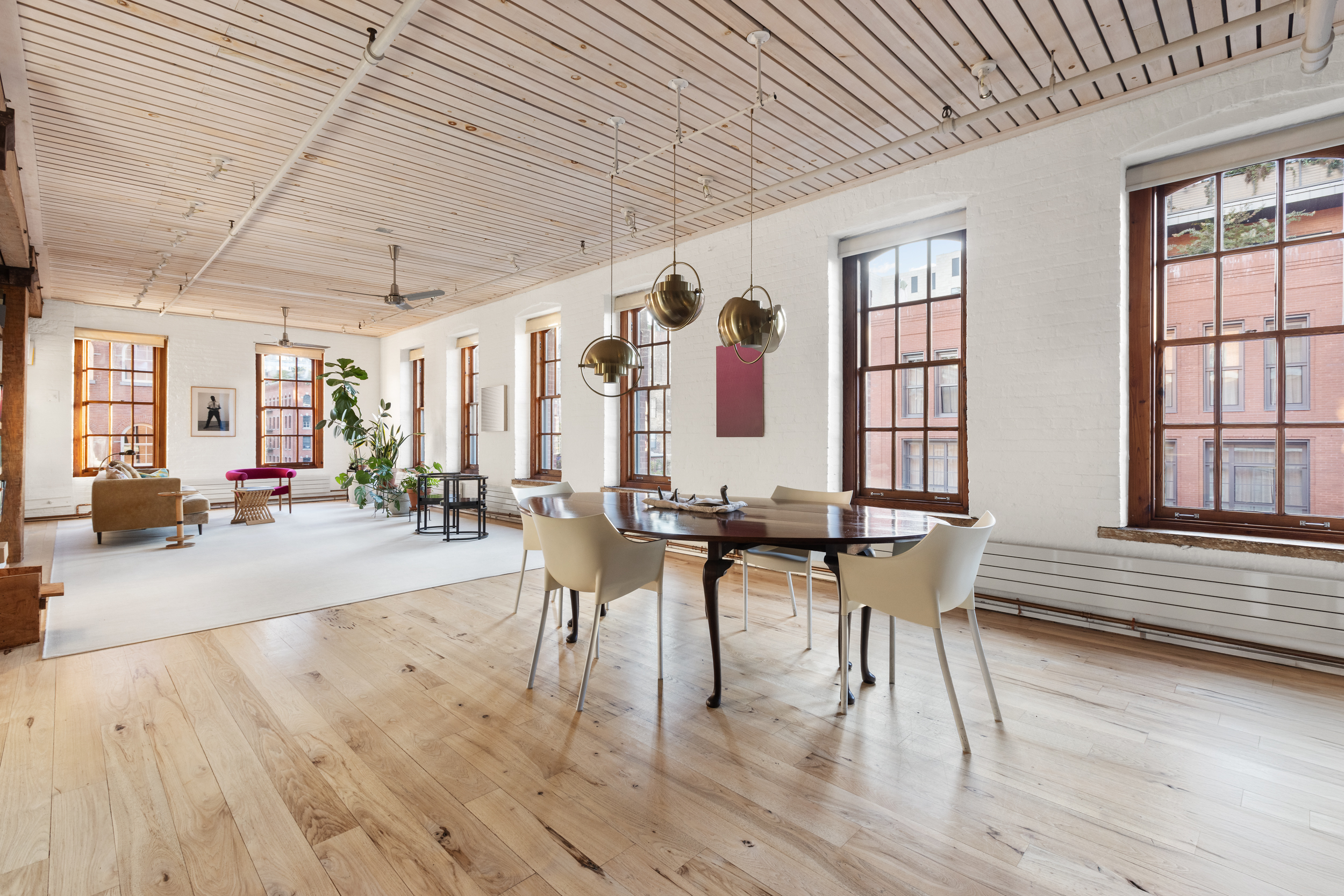 463 Greenwich Street Manhattan, NY 10013 - Photo 4 of 24 a view of a dining room with furniture and wooden floor