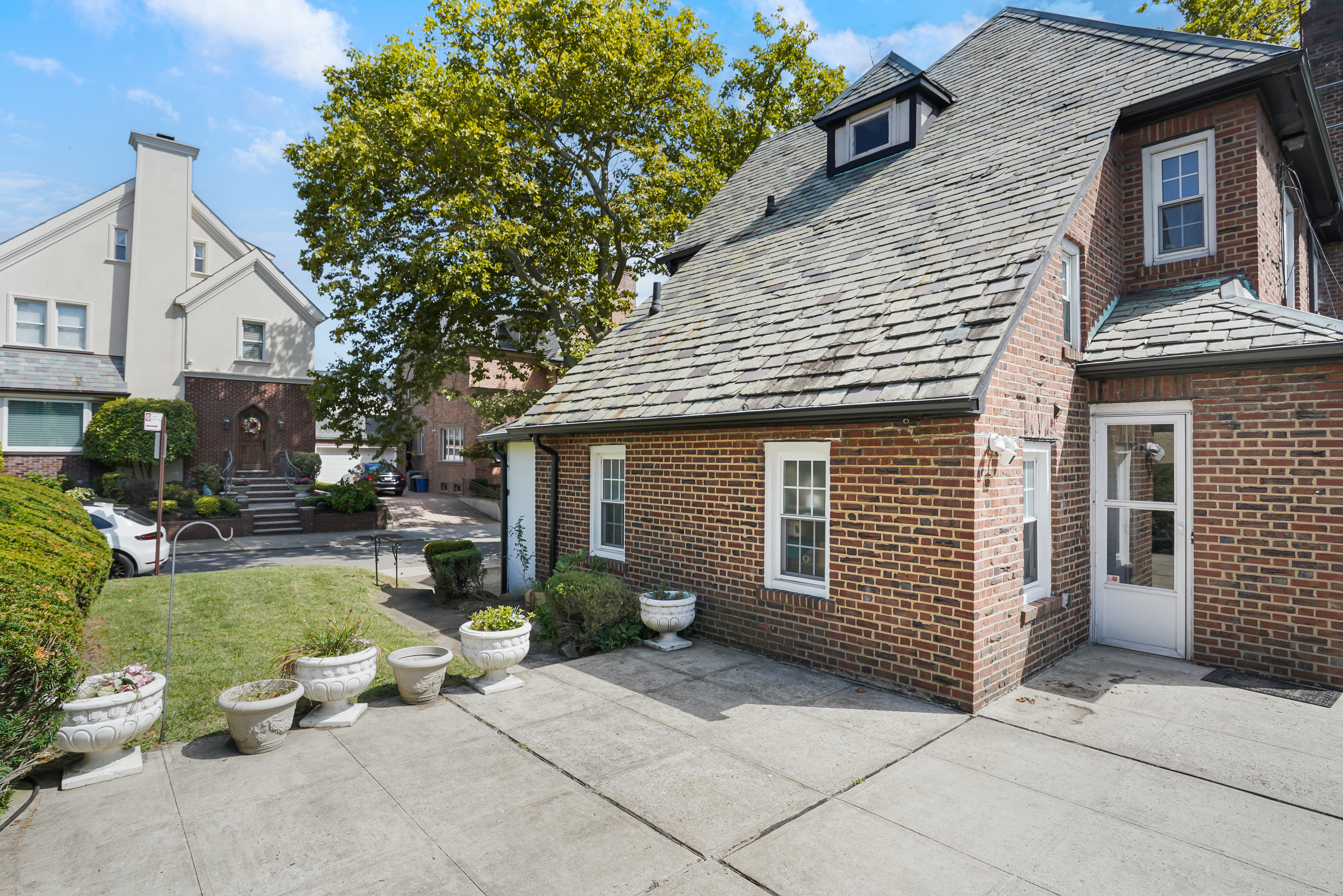 8028 Harbor View Terrace Brooklyn, NY 11209 - Photo 15 of 16 a view of a house with backyard and sitting area