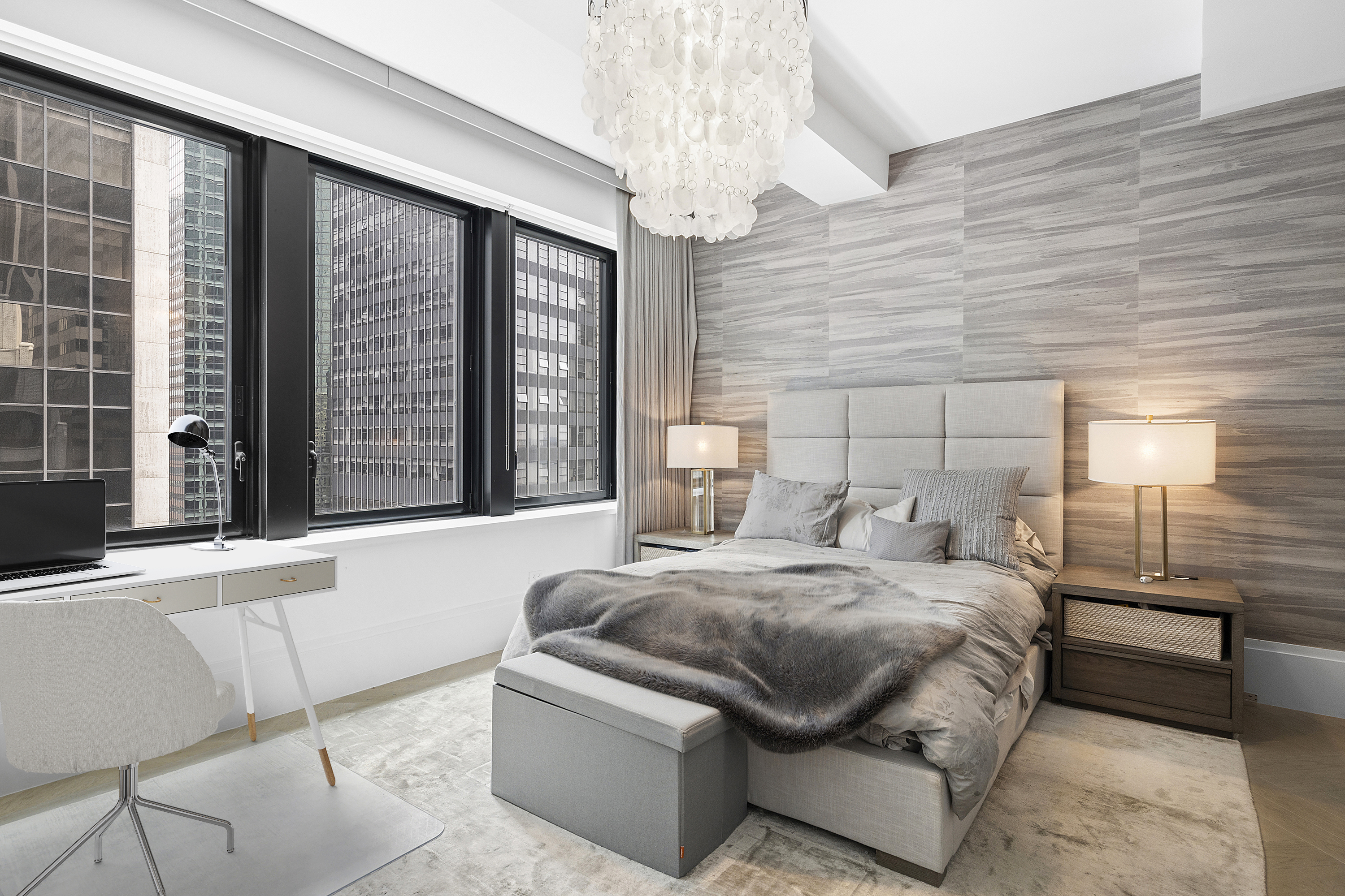 101 Wall Street, Unit 17A Manhattan, NY 10005 - Photo 5 of 13 a bedroom with a bed and a large window