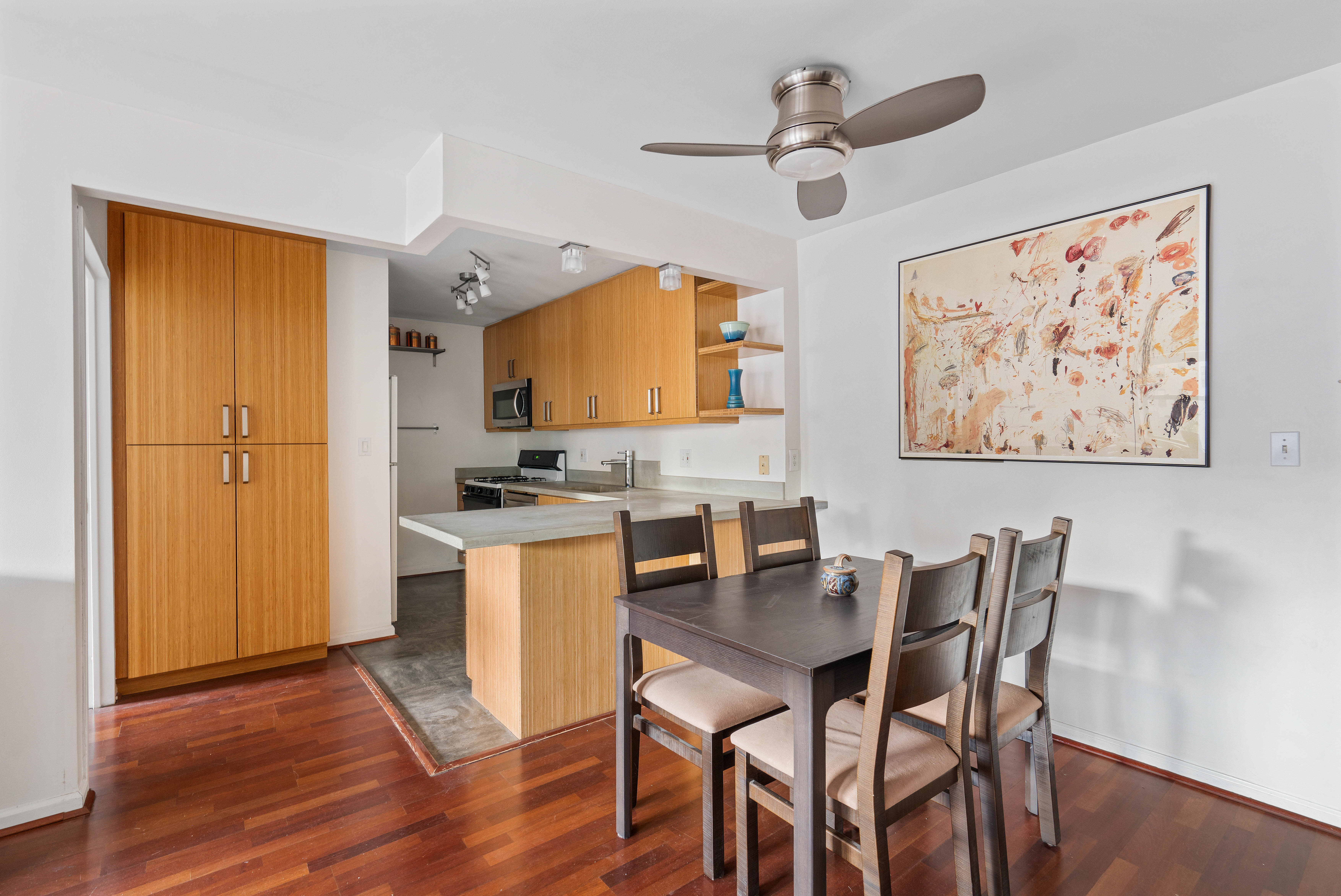 130 Lenox Avenue, Unit 522 Manhattan, NY 10026 - Photo 2 of 7 a view of kitchen with cabinets and wooden floor