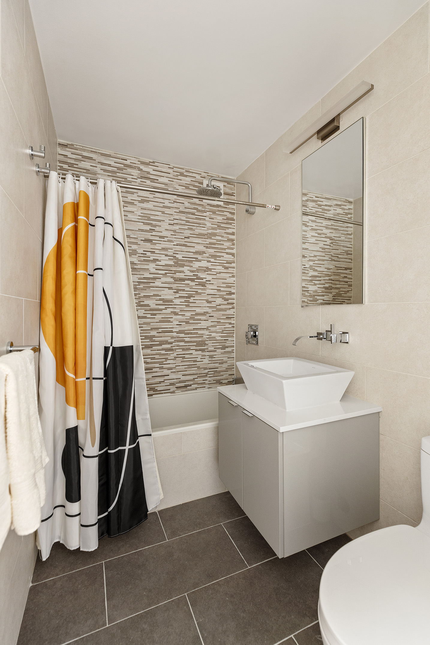 444 East 86th Street, Unit 15G Manhattan, NY 10028 - Photo 8 of 12 a bathroom with a sink a toilet and bathtub